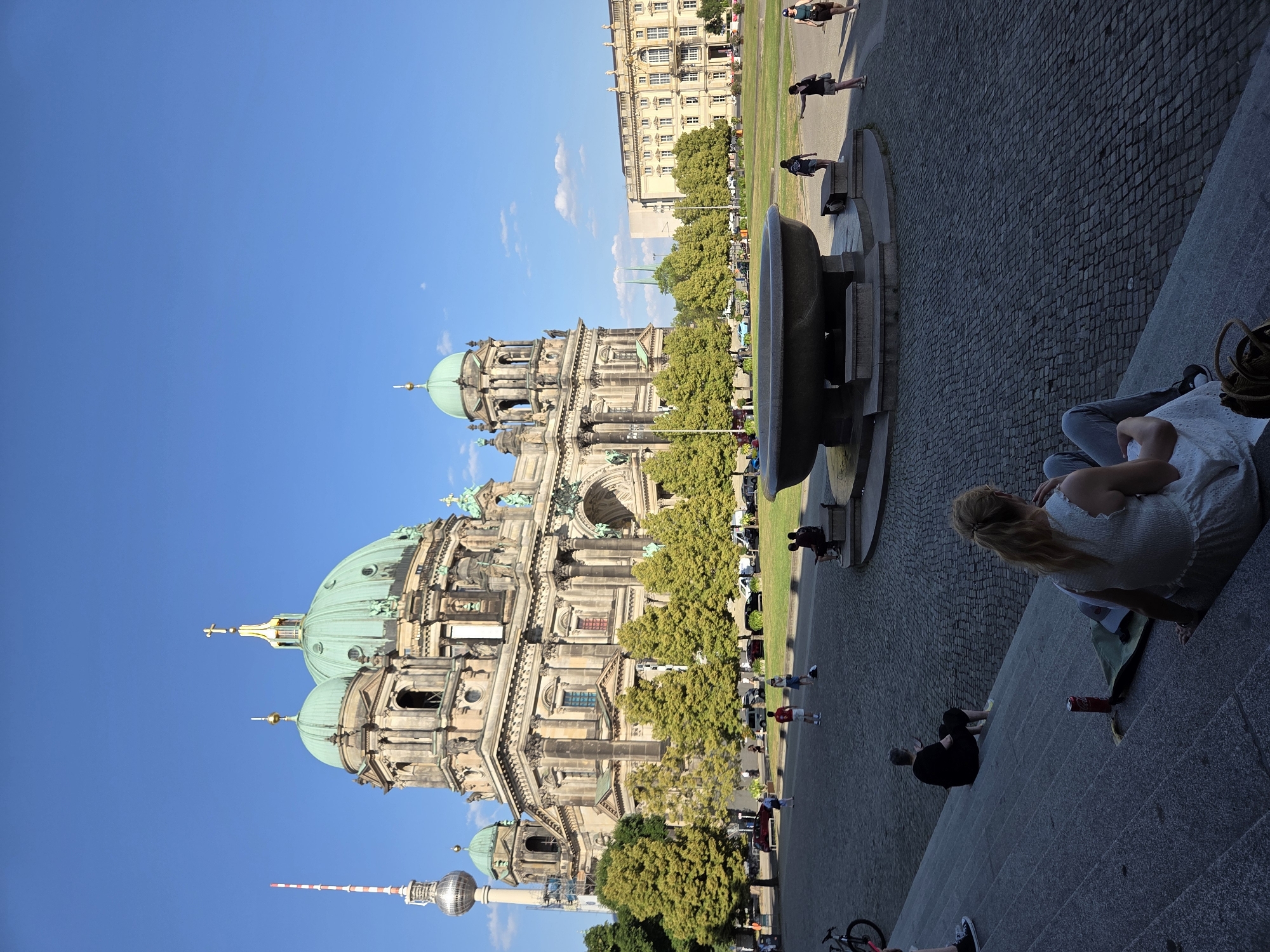 Sunny afternoon at Berlin Cathedral with fountains and balloons