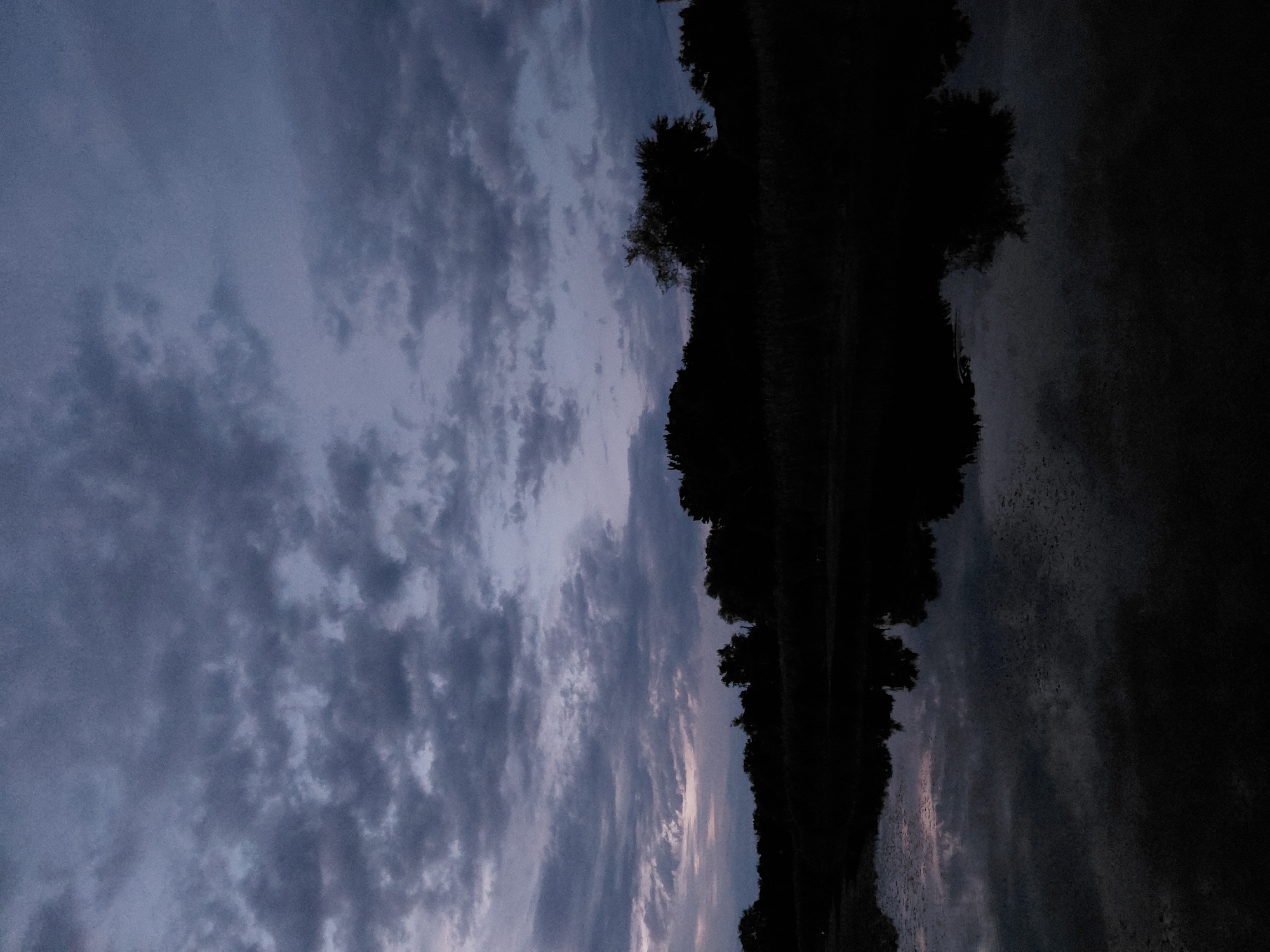 Evening bike ride through quiet rural landscape at dusk