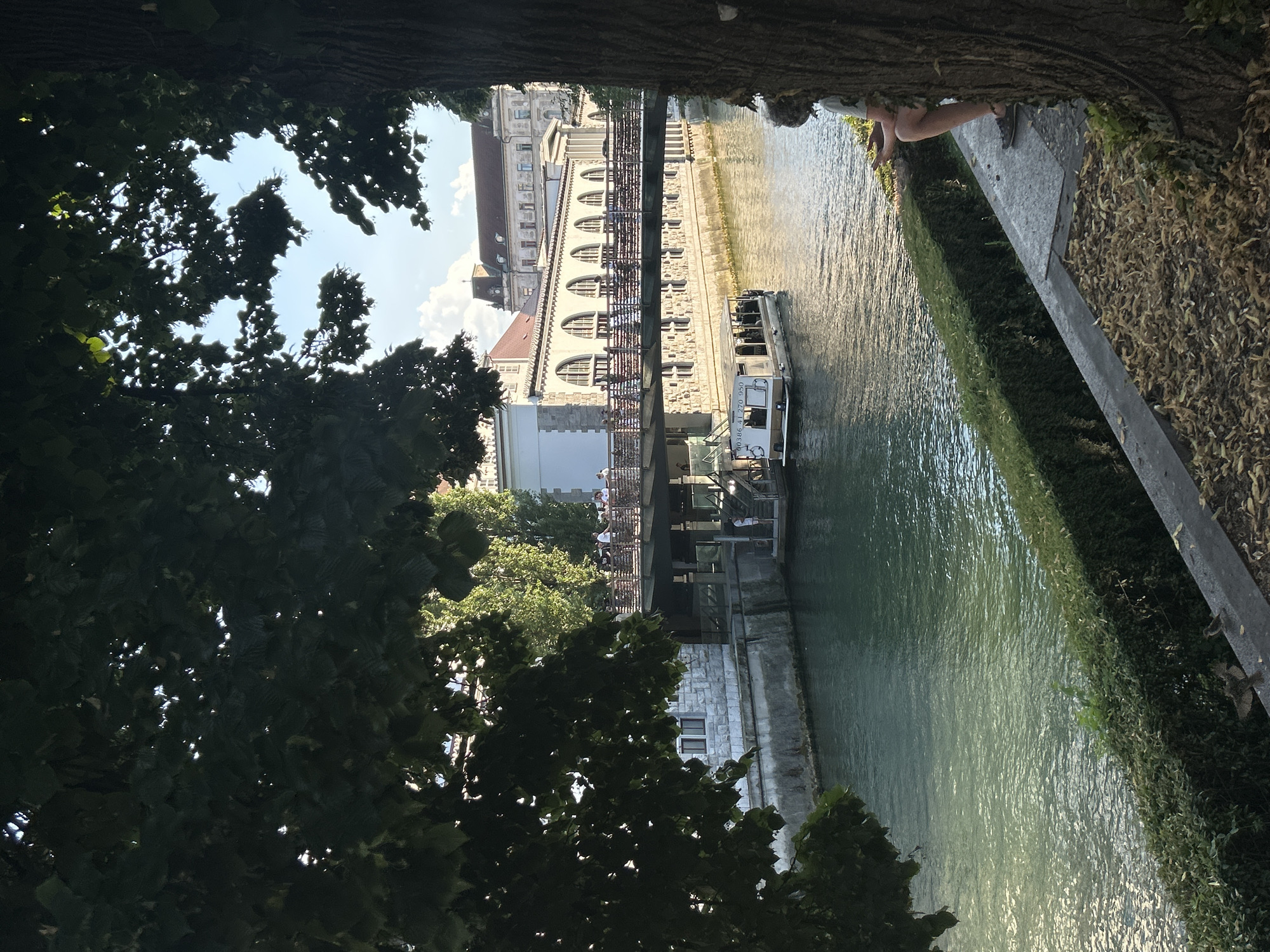 Canal boats, cobblestones, and a castle on the hill