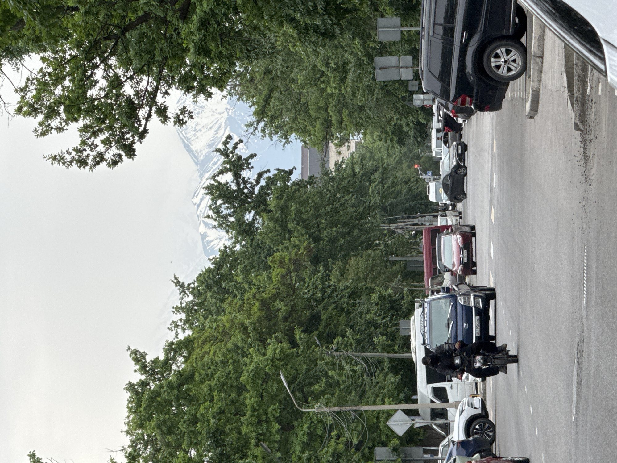 Motorcyclist navigates street traffic in Bishkek, Kyrgyzstan