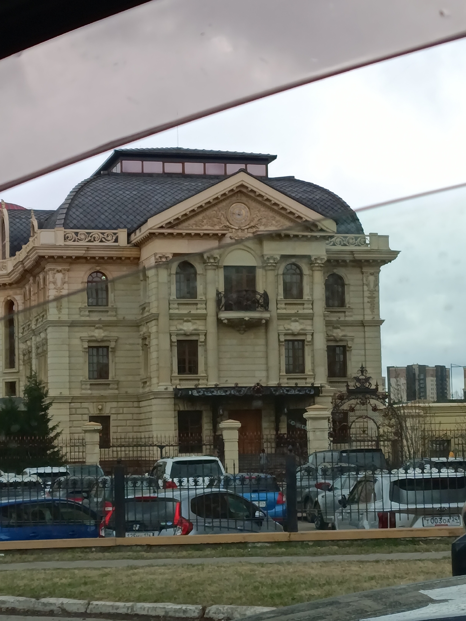 Three-story building with domed roof documented in Krasnoyarsk