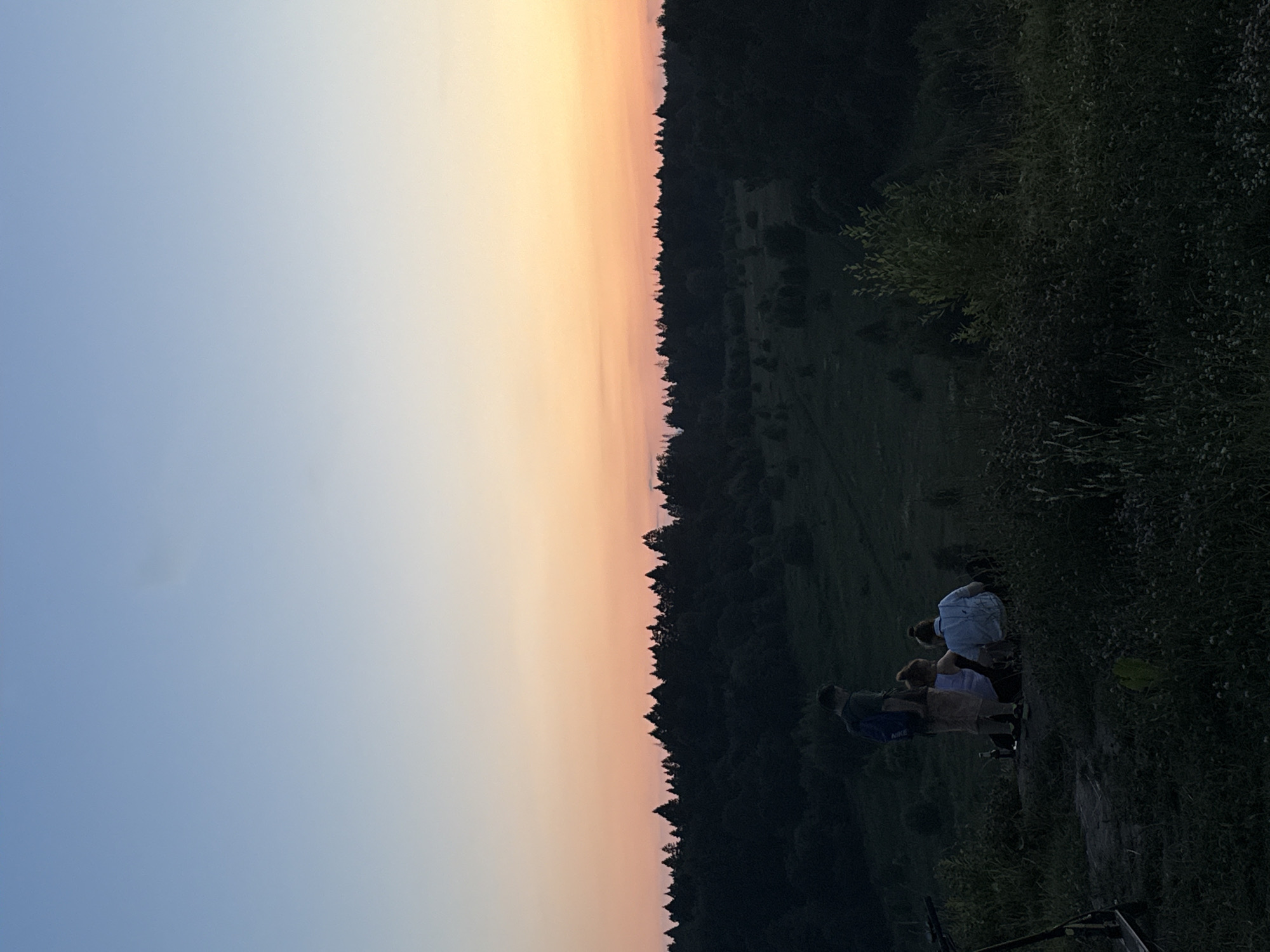 Group hangs out on a Moscow hillside at dusk