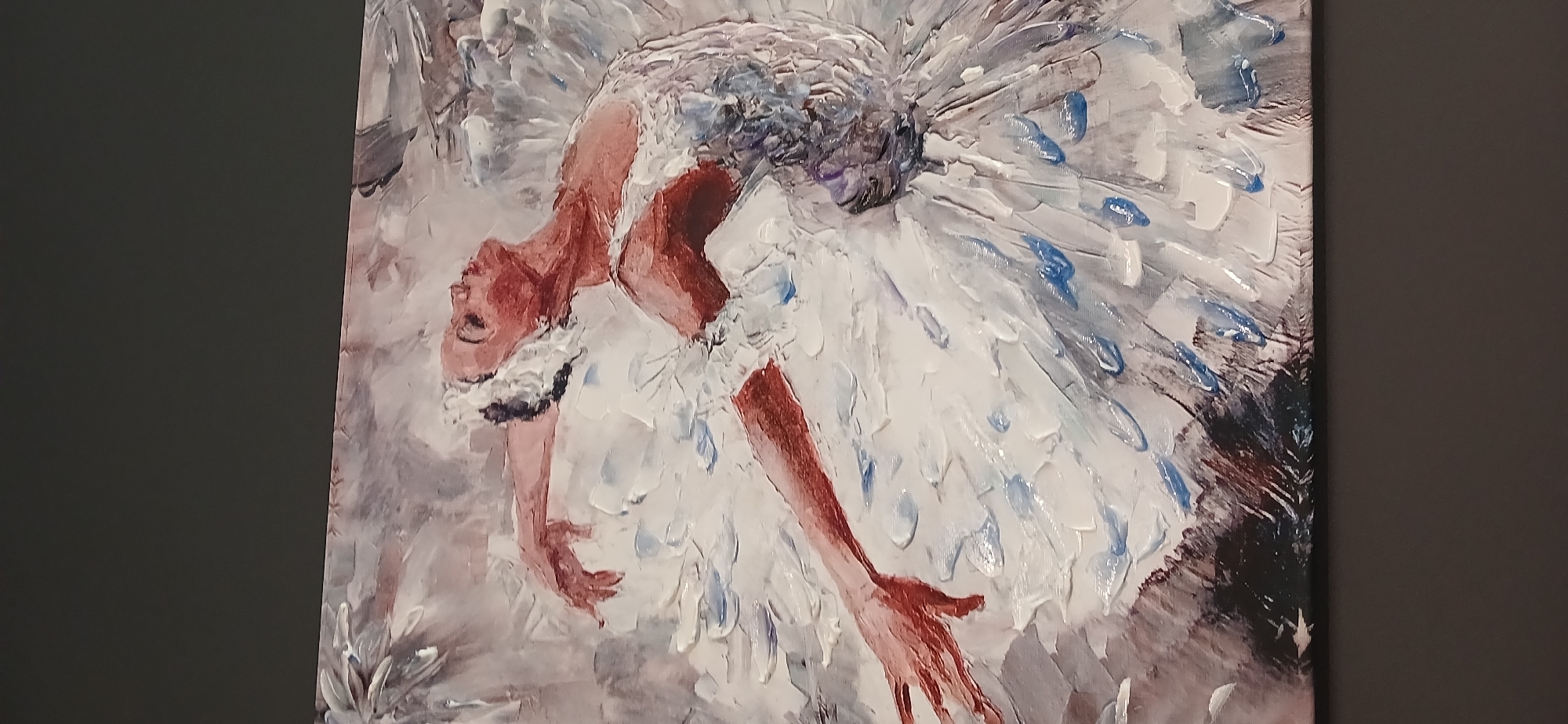 Ballerina painting in white tutu, arms extended mid-pose