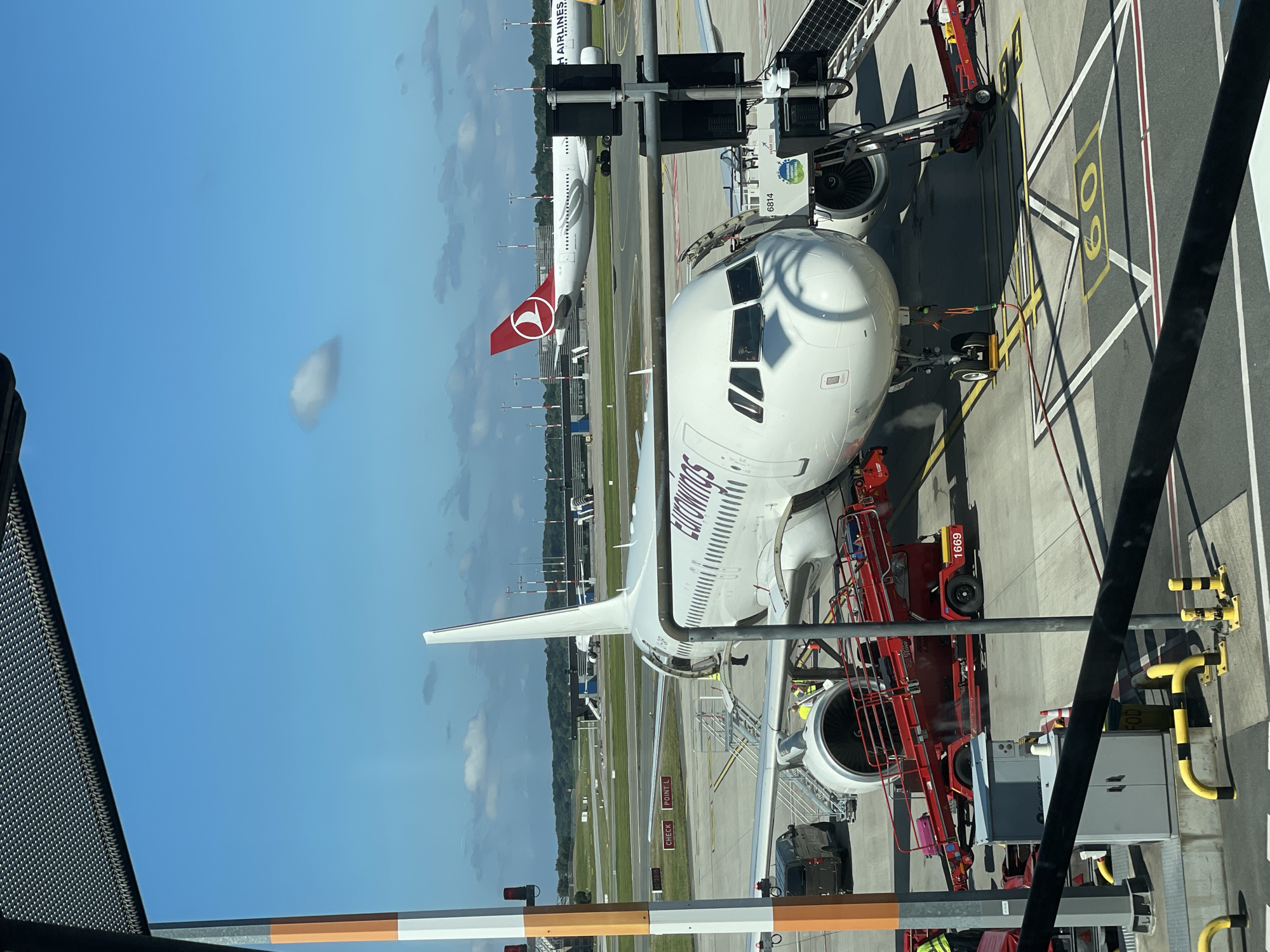 Eurowings and Swiss aircraft parked at Hamburg Airport gates