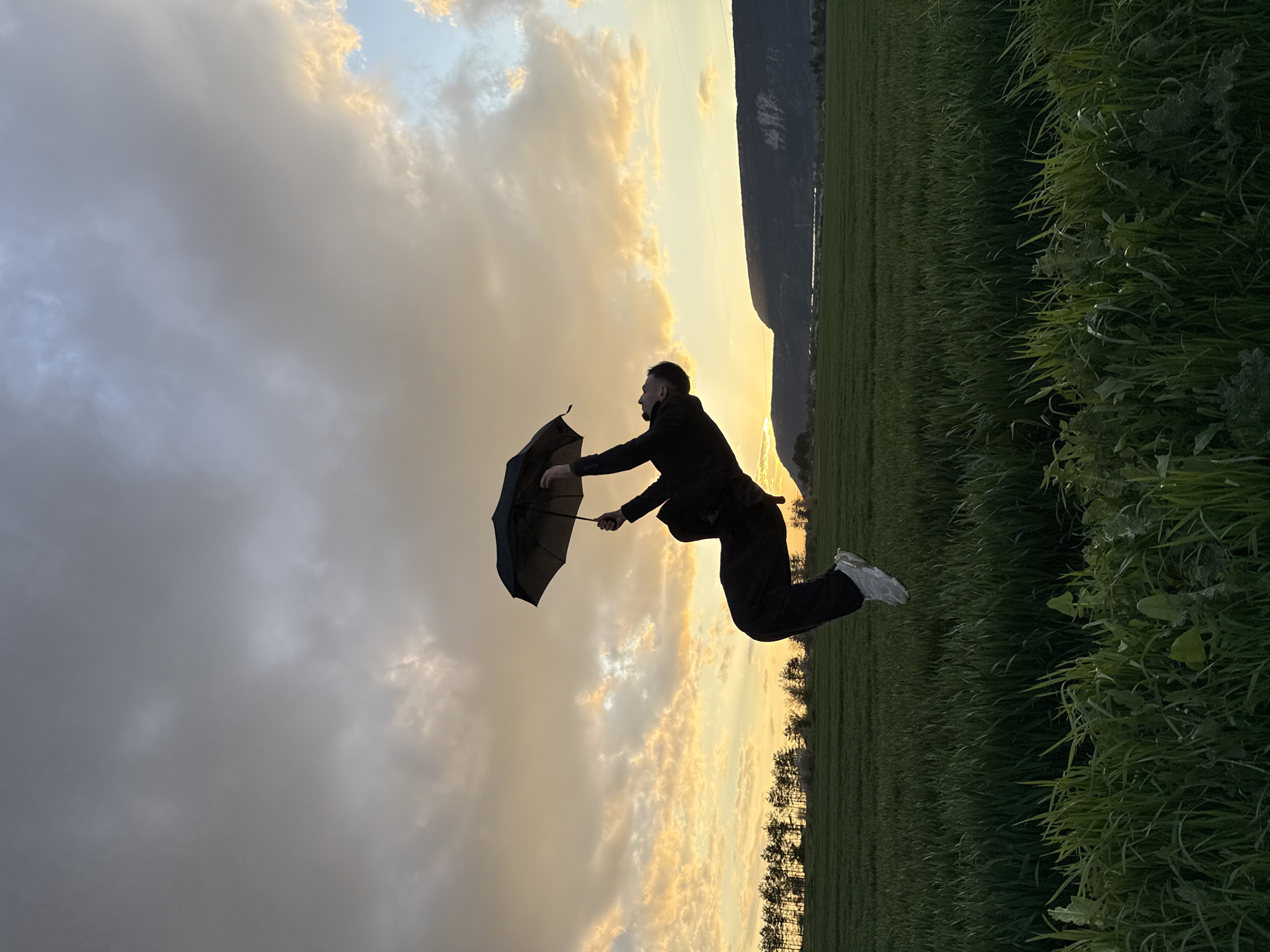 Man conducts sunset photography session in Bulgarian countryside