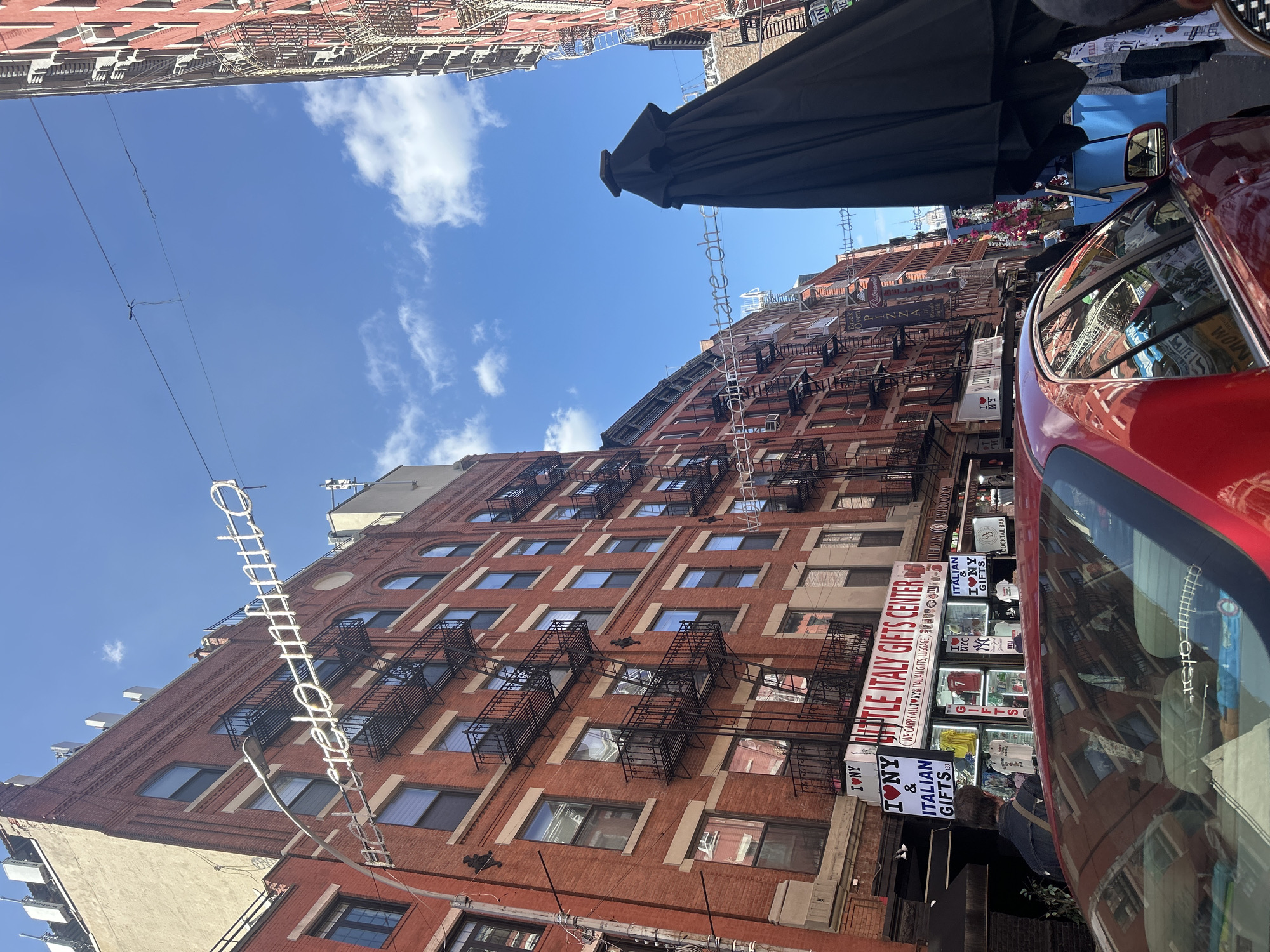 Evening dining scene documented in NYC's Little Italy