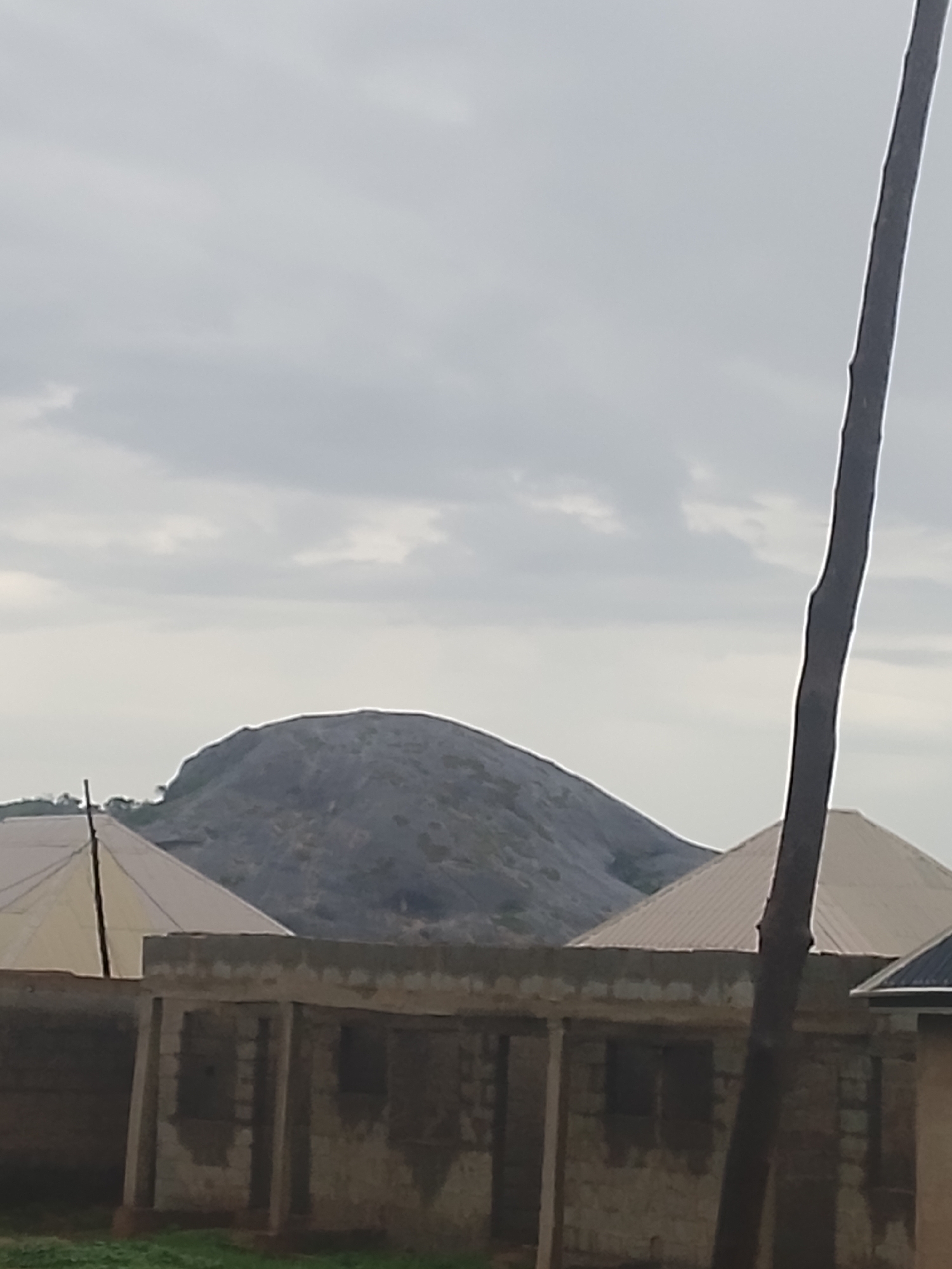 Construction workers install ceilings at Suleja building site