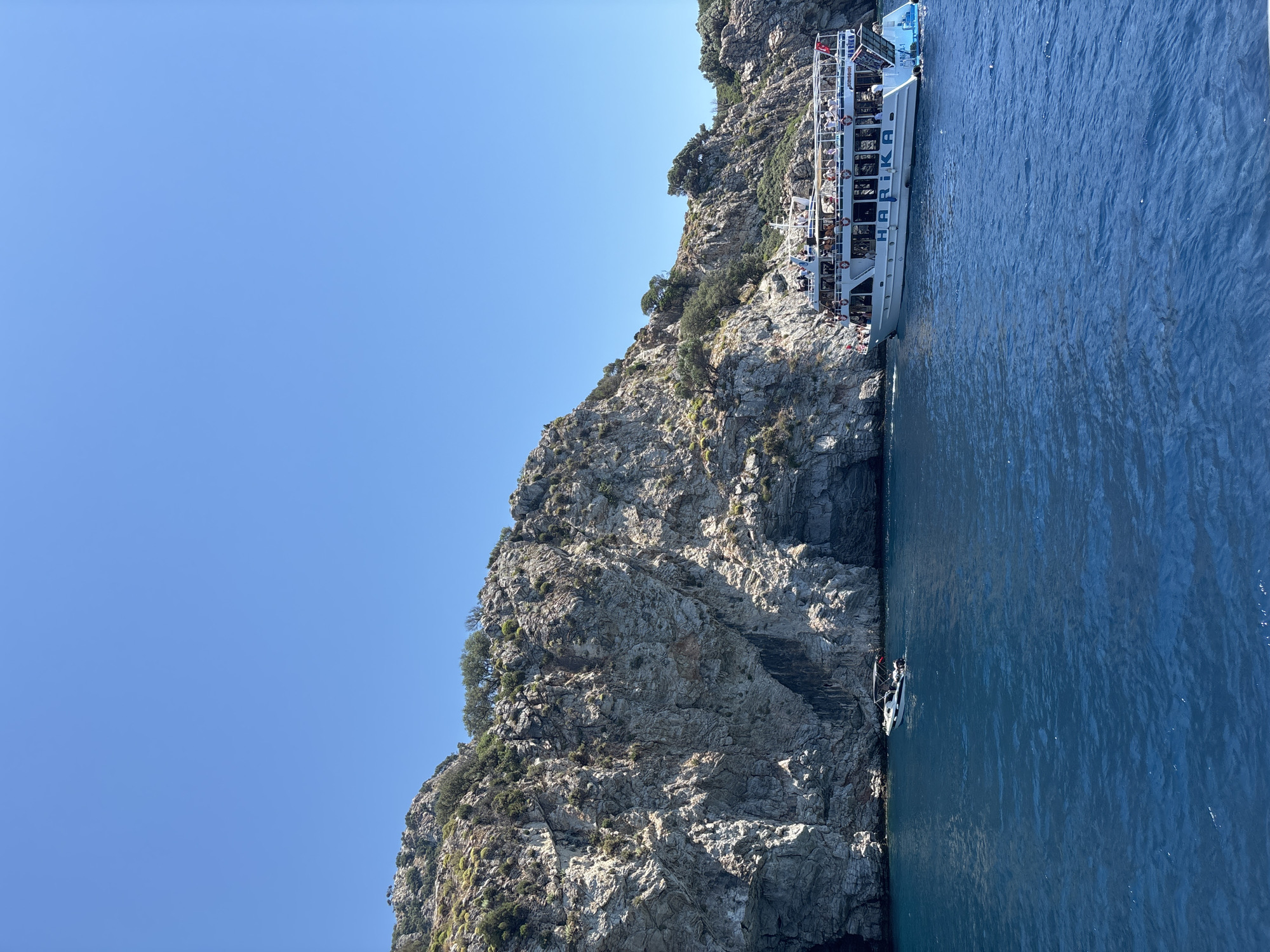 Tourist boat operates along Marmaris coastline in Turkey