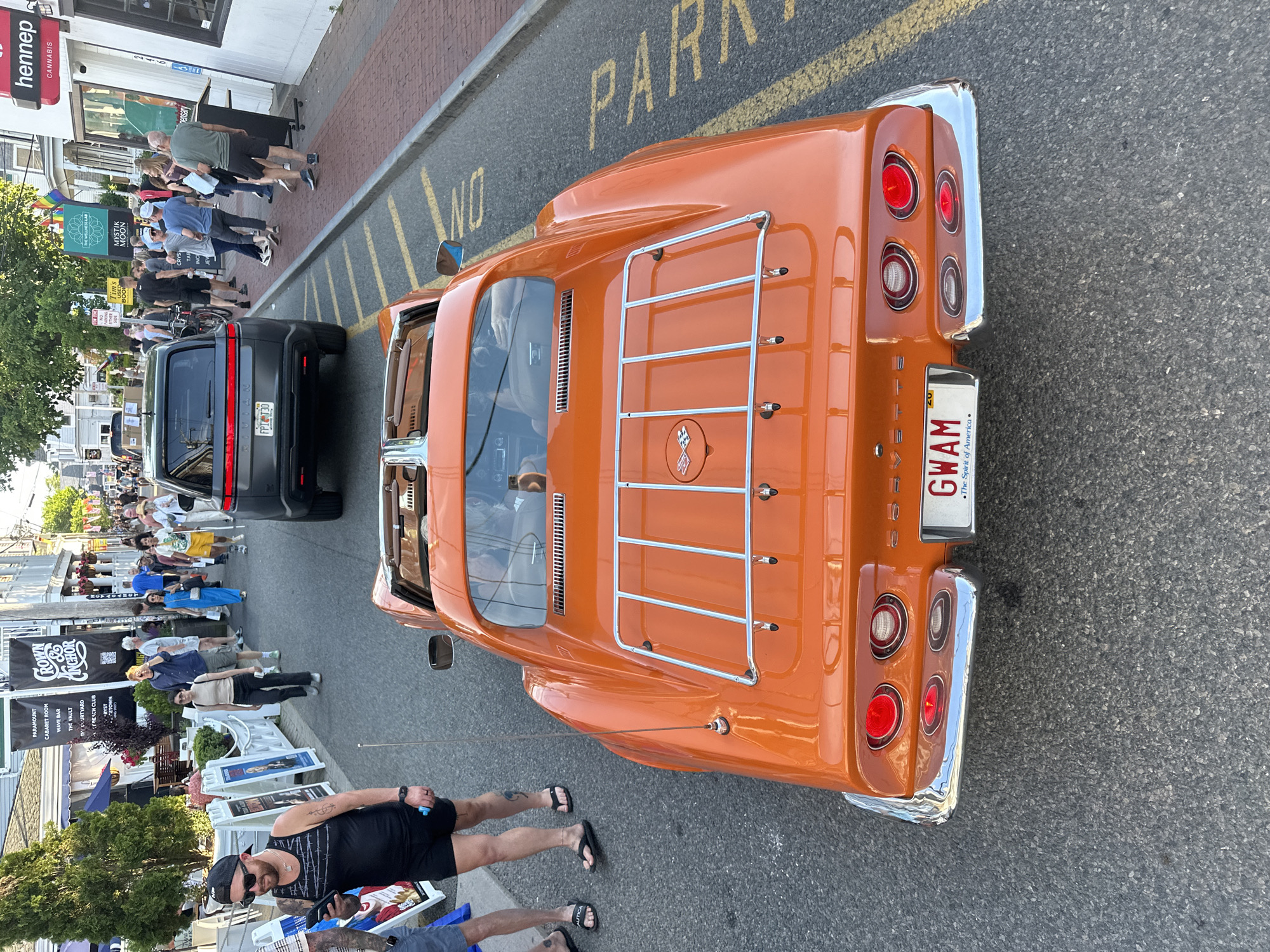 Vintage orange Corvette parked on a Provincetown street