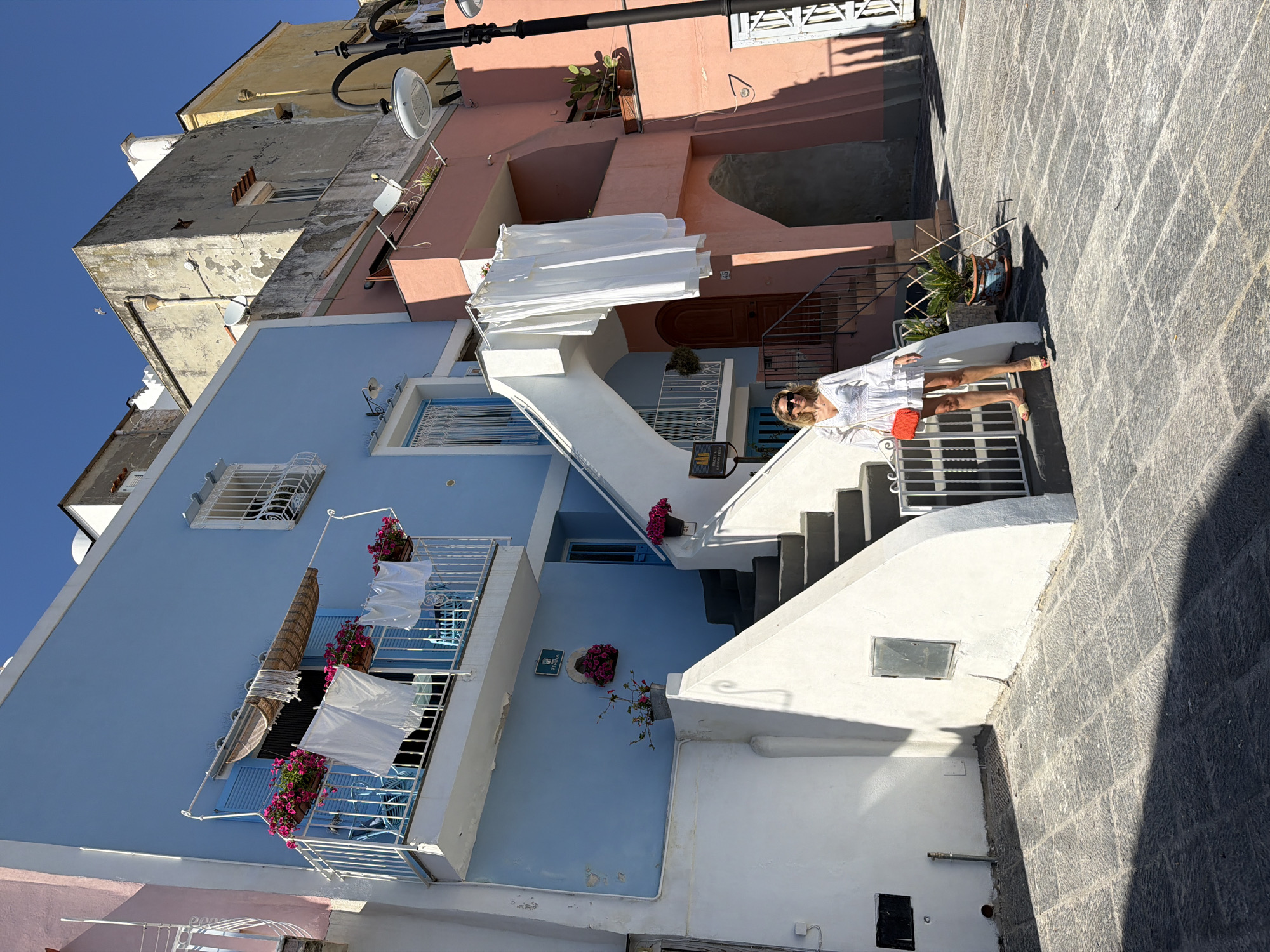 Daily life scenes documented in colorful Procida, Italy