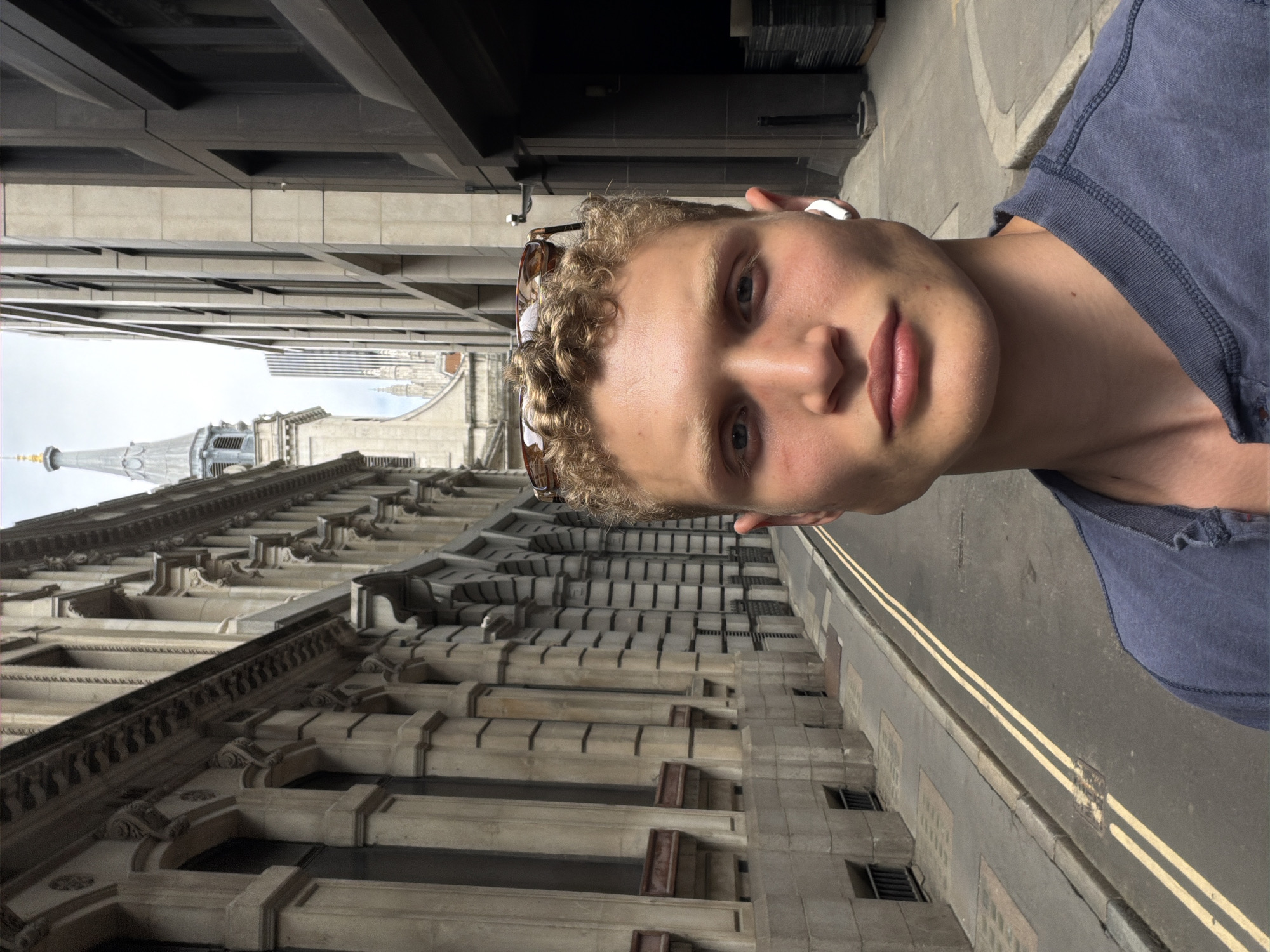 Quick photo series on a London street, blue shirt and sunglasses.