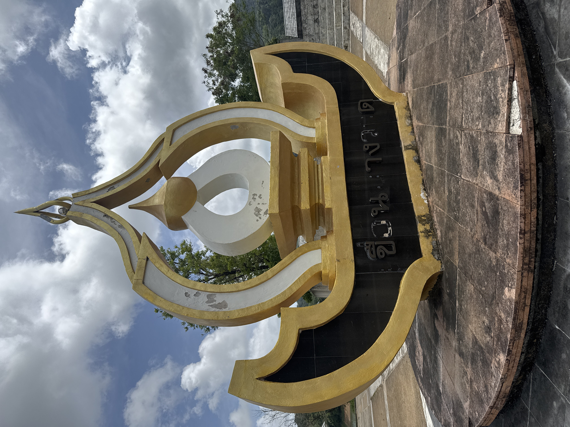 Gold-white monument with Thai script documented in Kathu, Thailand