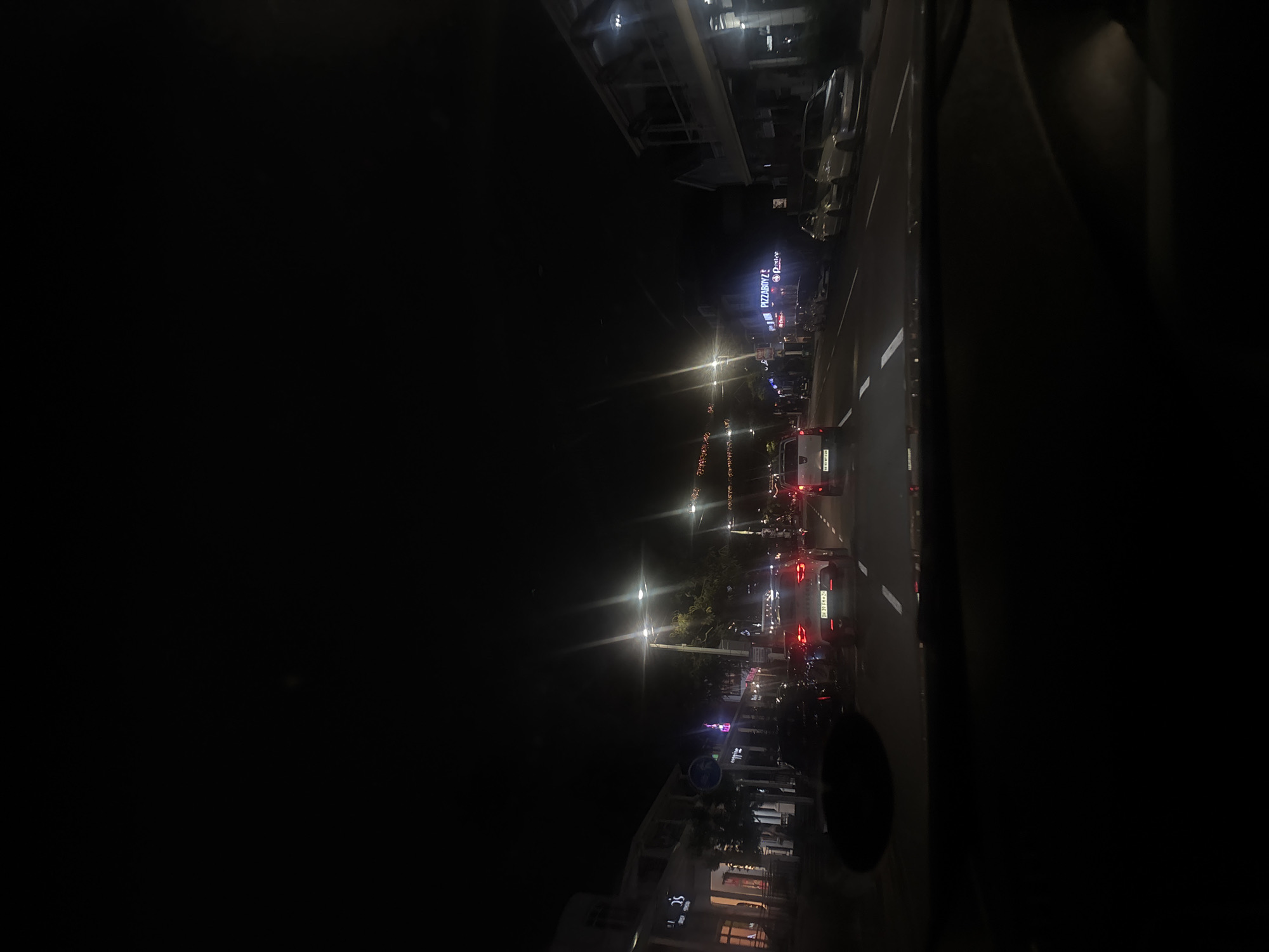 Evening traffic flows through illuminated Durban streets