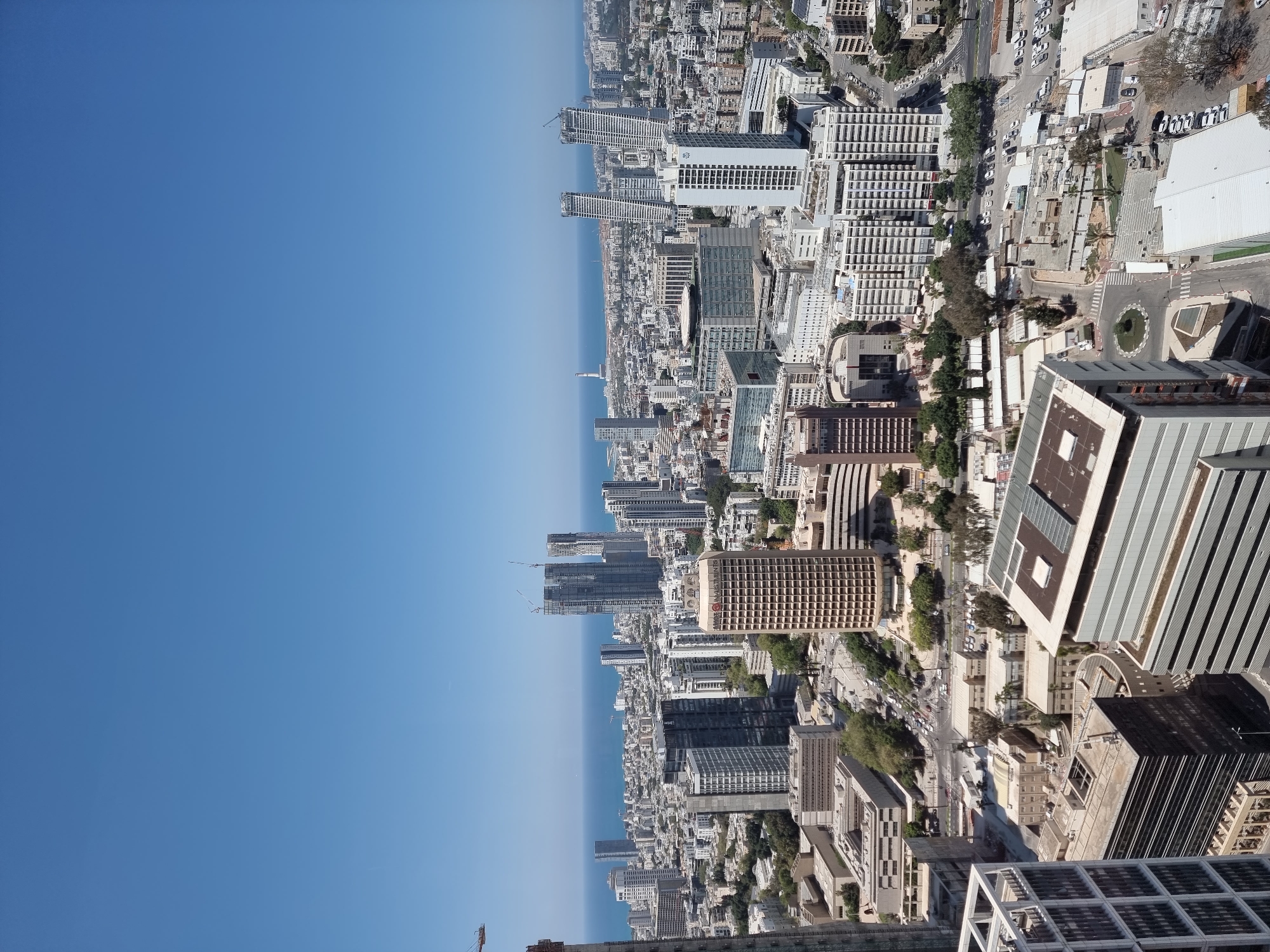 Coastal city aerial views and ride-sharing imagery captured in Jordan