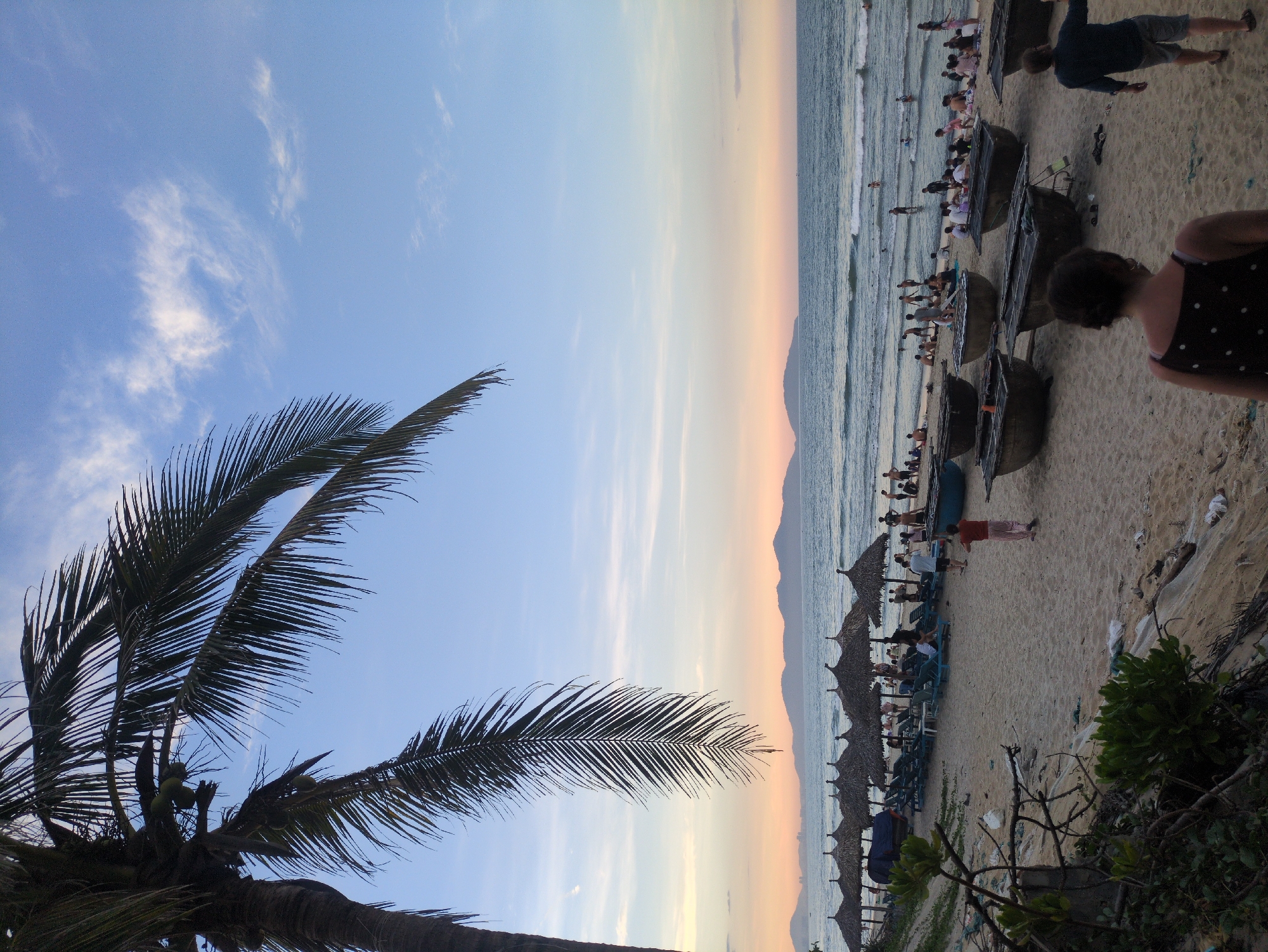 An Bang Beach at golden hour, afternoon crowd to dusk