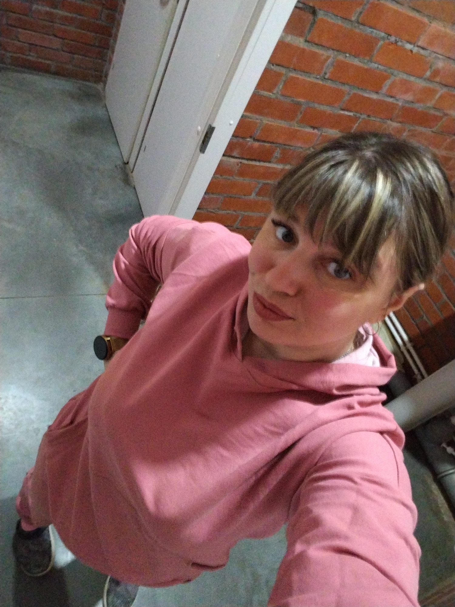 Woman takes evening selfies with coffee in Rusanovo, Russia
