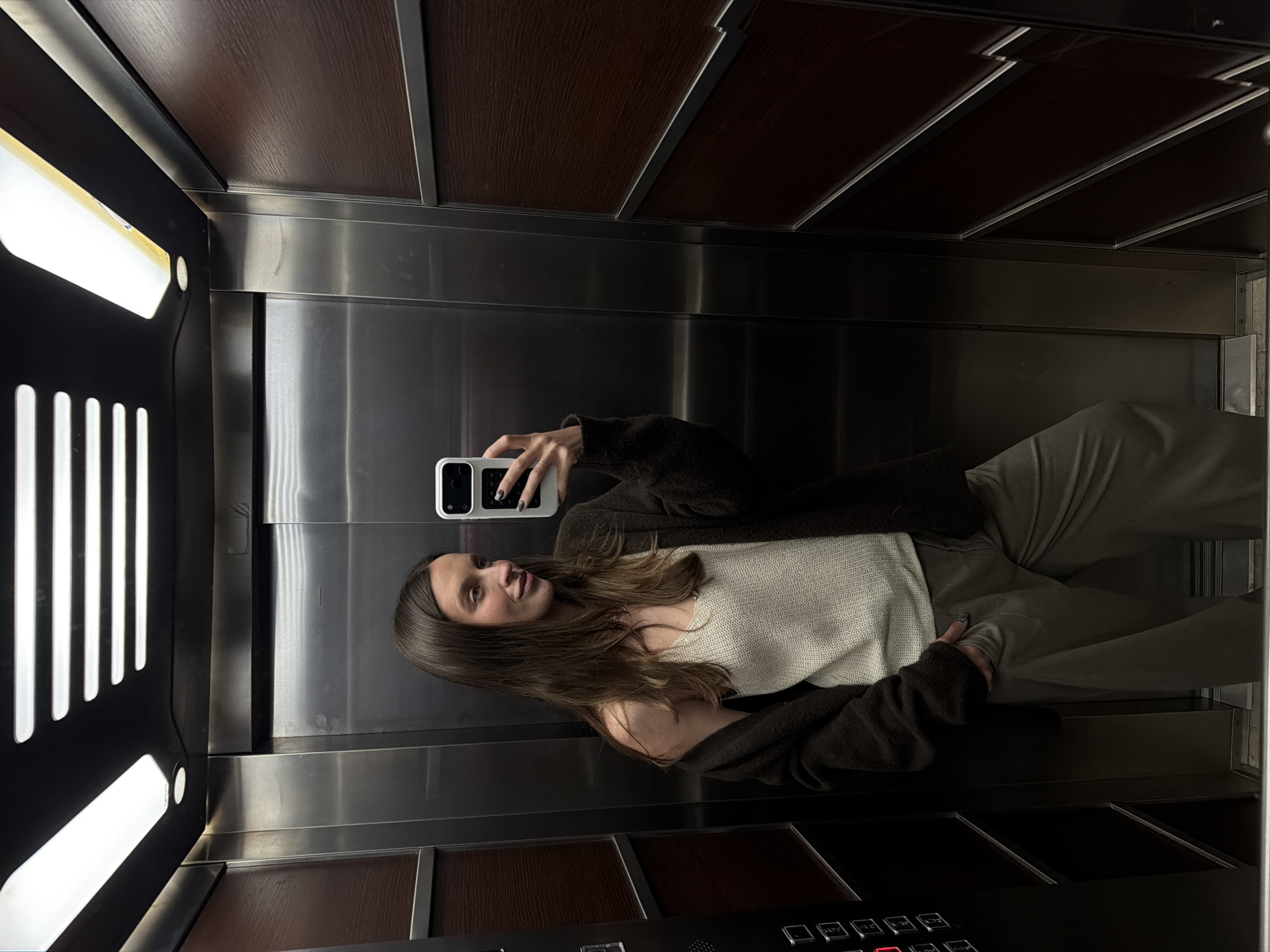 Woman Takes Selfie in Elevator in Budva, Montenegro