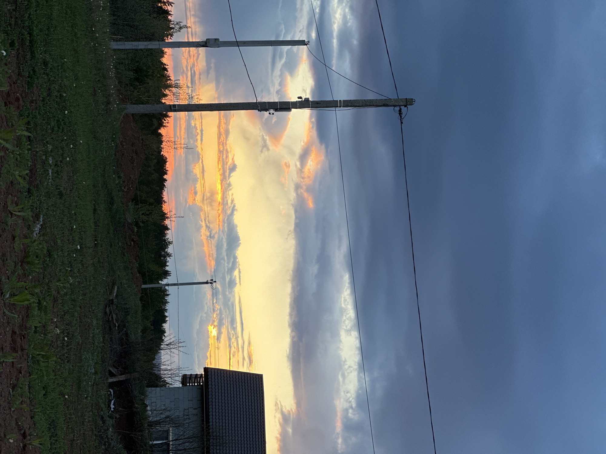 Dramatic sunset contrasts with storm clouds over Прикамский, Russia