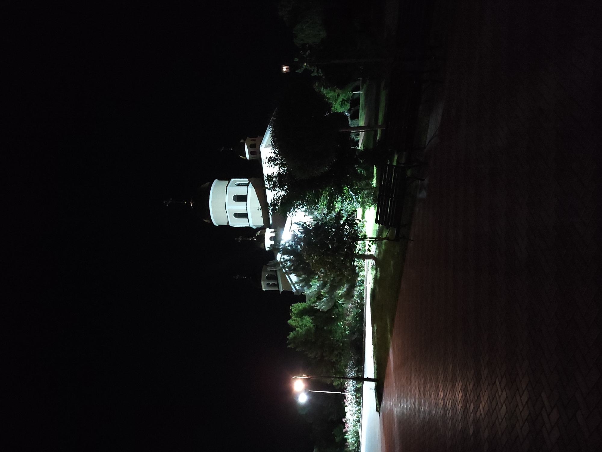 Historic buildings photographed under nighttime illumination during evening hours