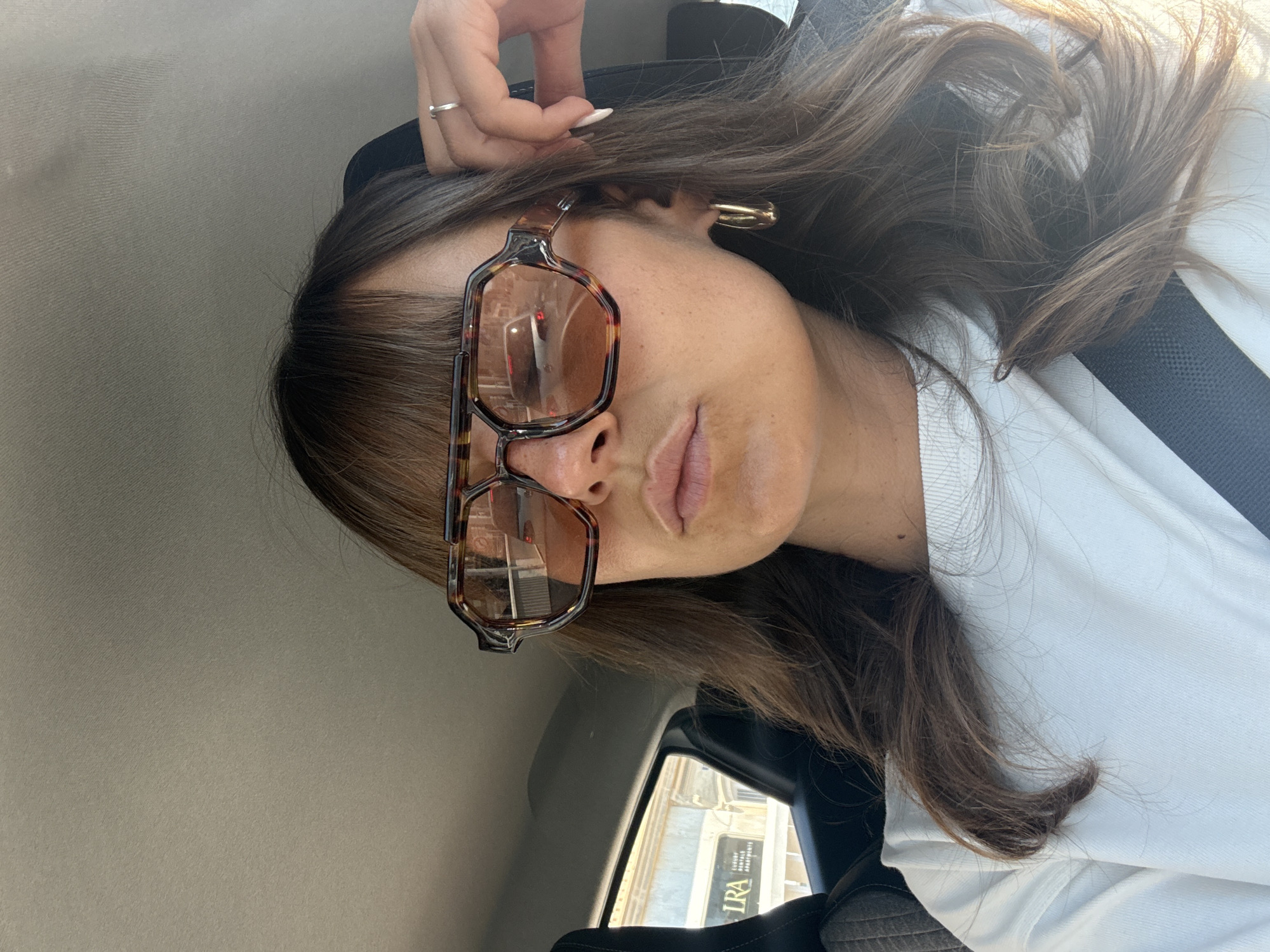 Woman photographed in stationary car in Cannes