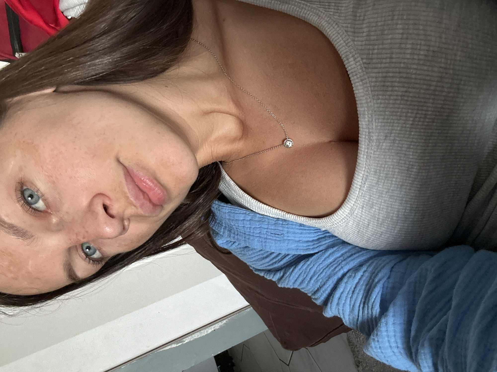 Woman takes multiple selfies in Fredenbeck, Germany