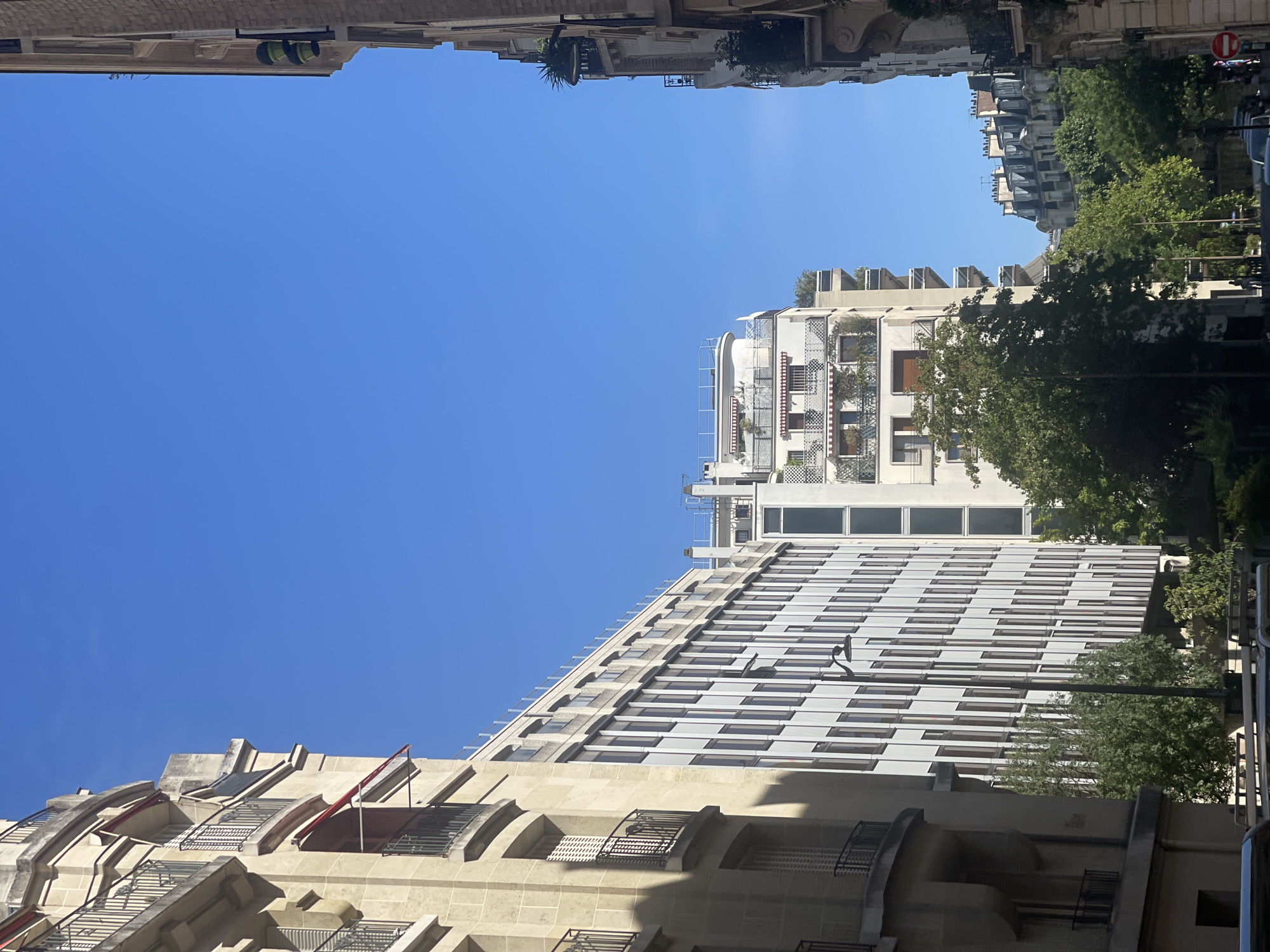 Sunny afternoon stroll through classic Paris streets in July
