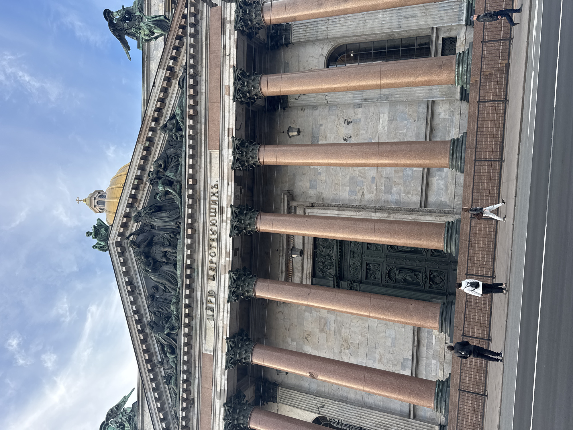 Tourist documents St. Isaac's Cathedral golden dome in Saint Petersburg