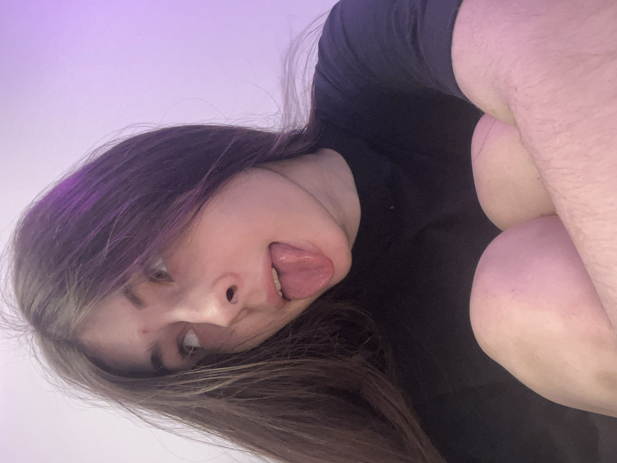 Young woman takes playful selfies in Saint Petersburg bedroom