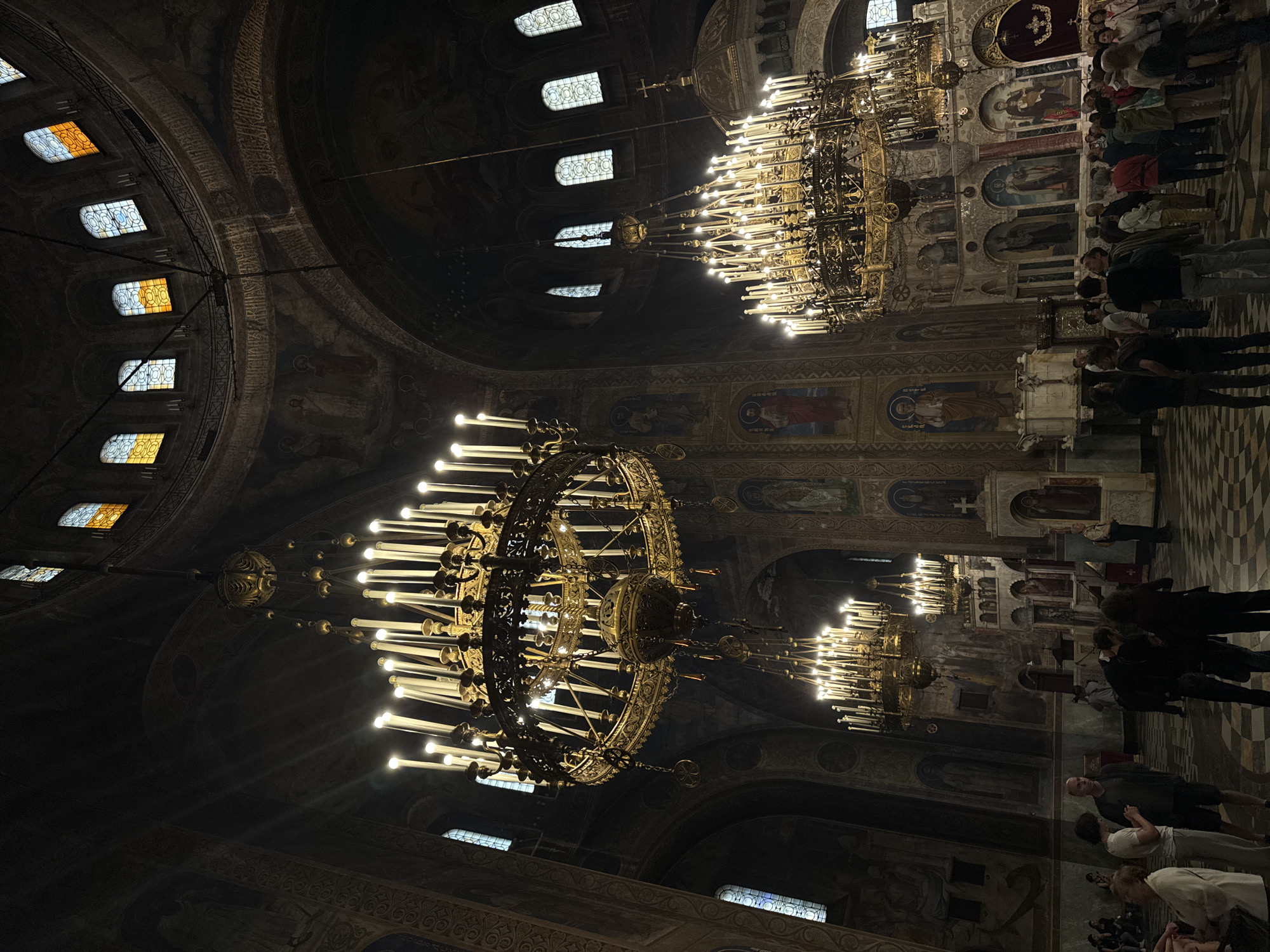 Formal ceremony with luxury cars at ornate church