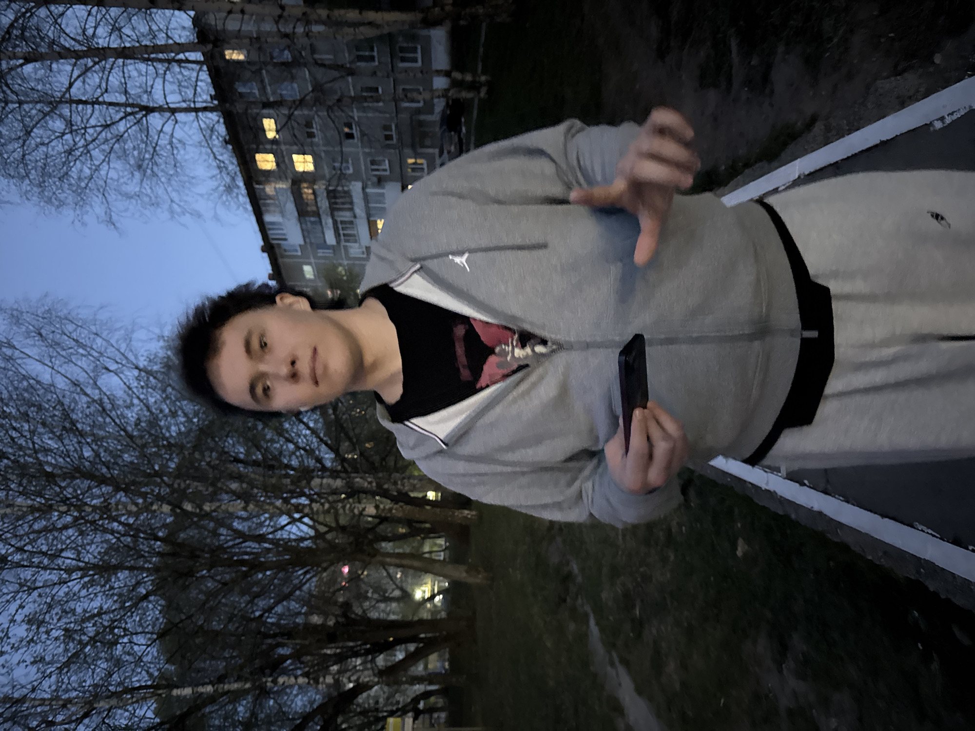 Young man spotted with phone outside building in Perm