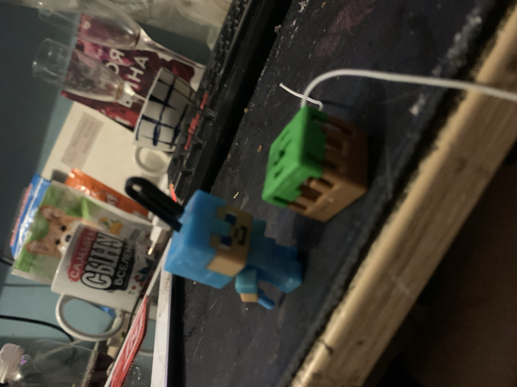 Kolpino home desk, RGB gear, Minecraft figures, and a pug