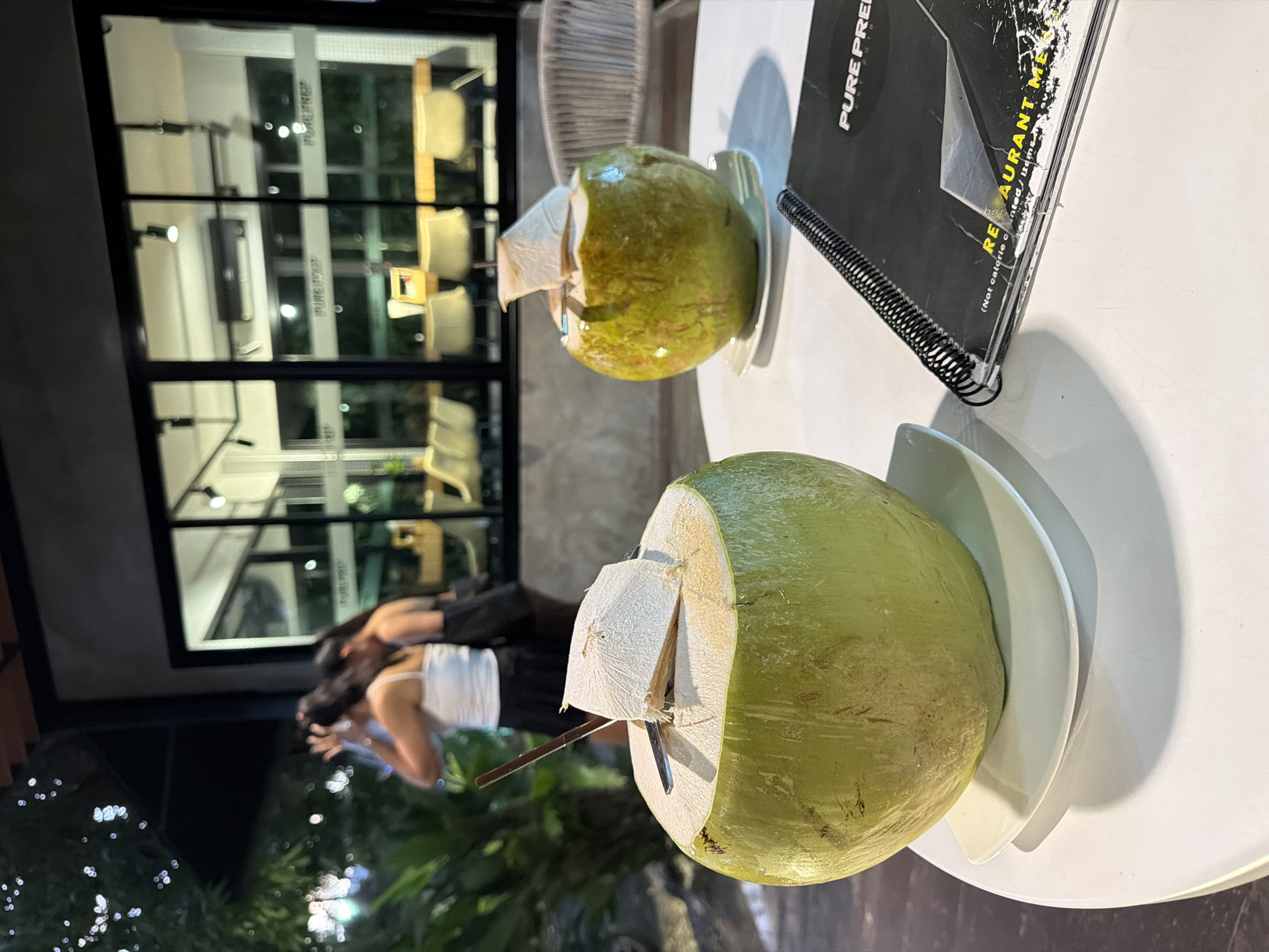 Fresh coconuts served at restaurant in Chalong, Thailand