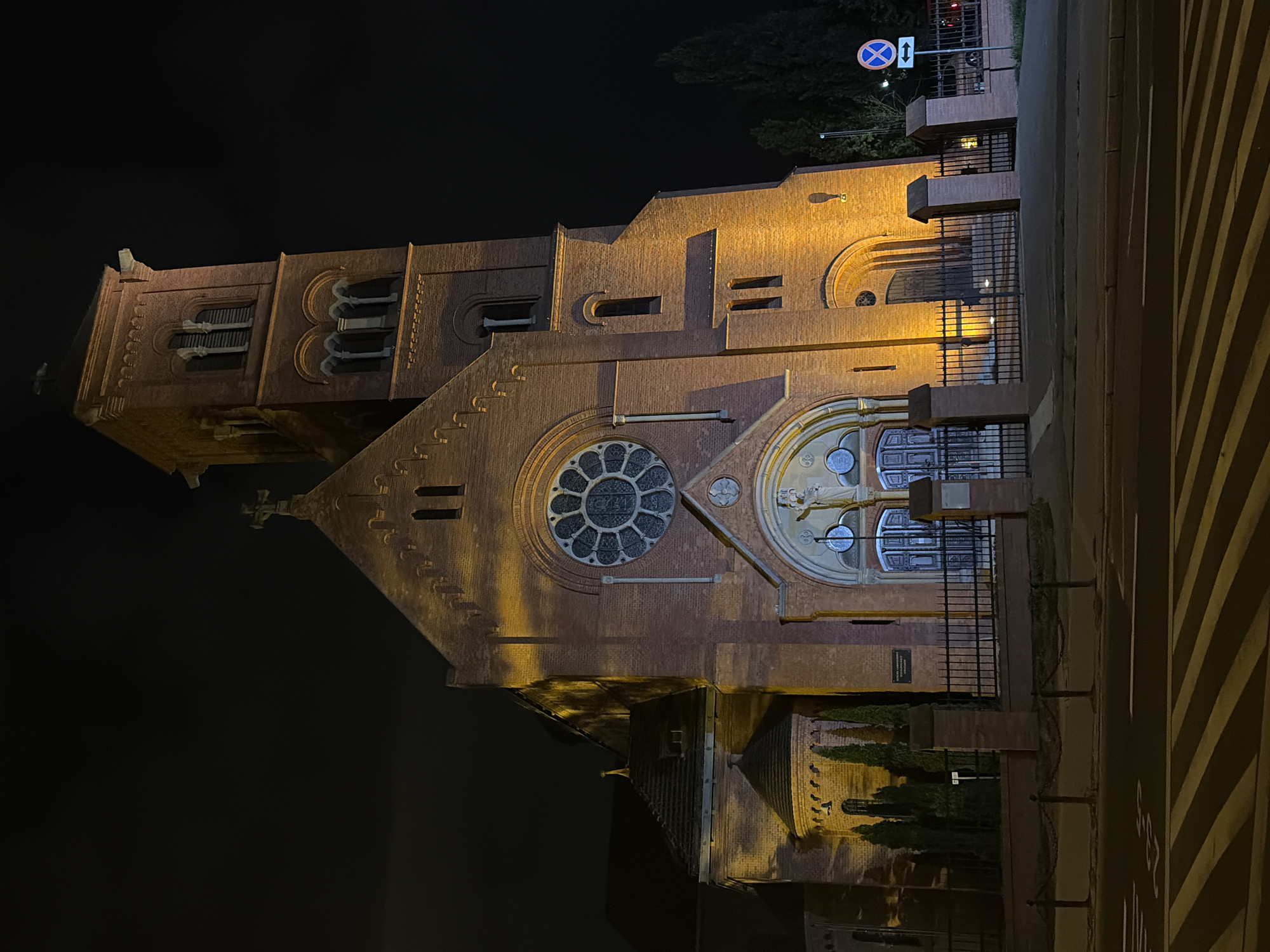Poznań streets and a lit church on a summer night