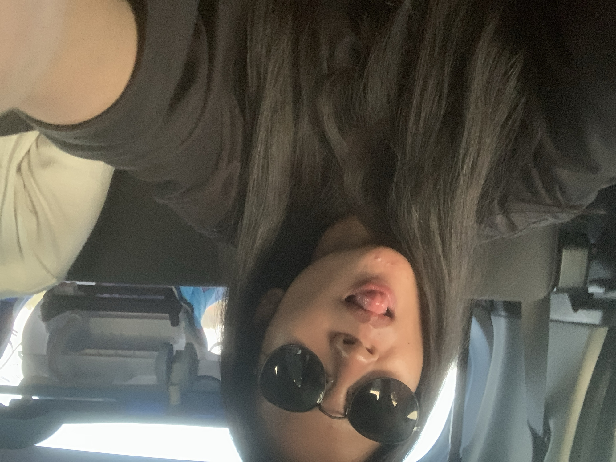 Family takes playful selfies during car trip in Indonesia