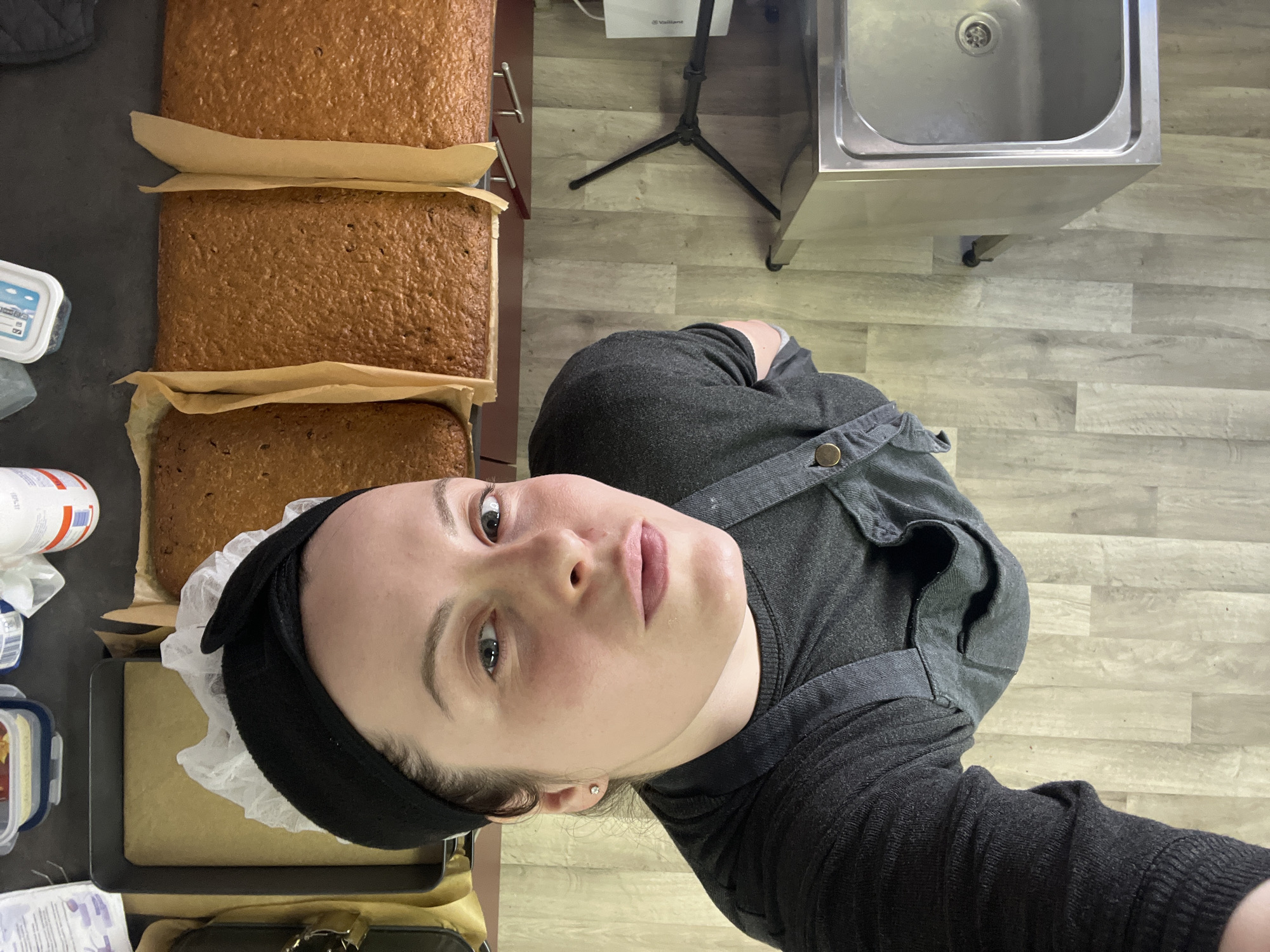 Woman documents commercial baking session in Meisenheim kitchen
