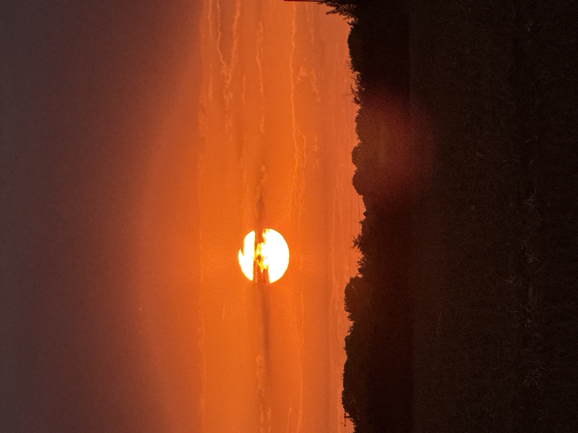 Deep red and orange sunset over rural Great Yarmouth