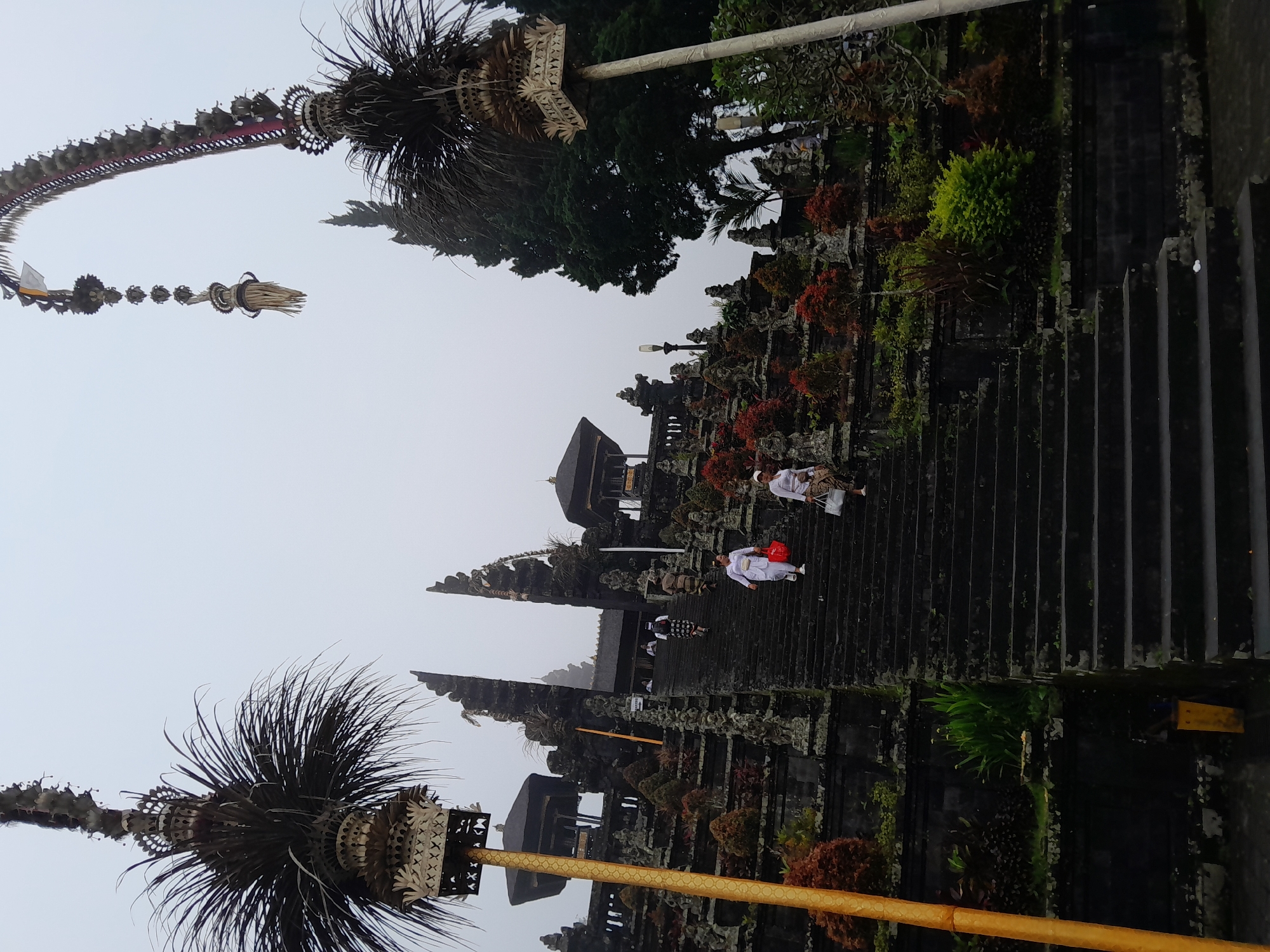 Foggy morning at Balinese temples in Rendang draws visitors