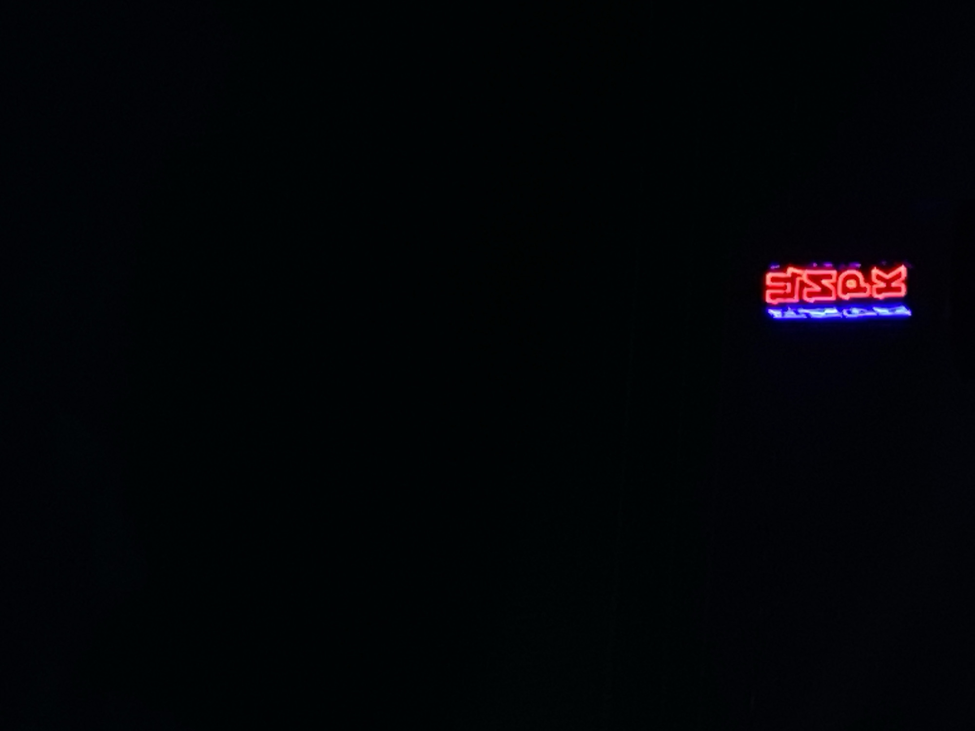 Evening observations capture restaurant signage and hockey display in Шебунино