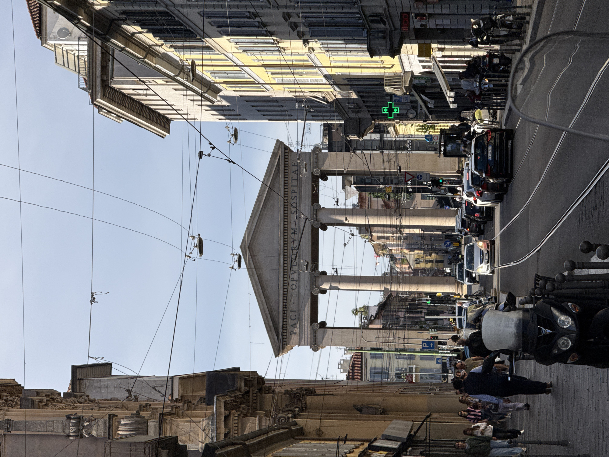 Milan's Arco della Pace documented under clear afternoon skies