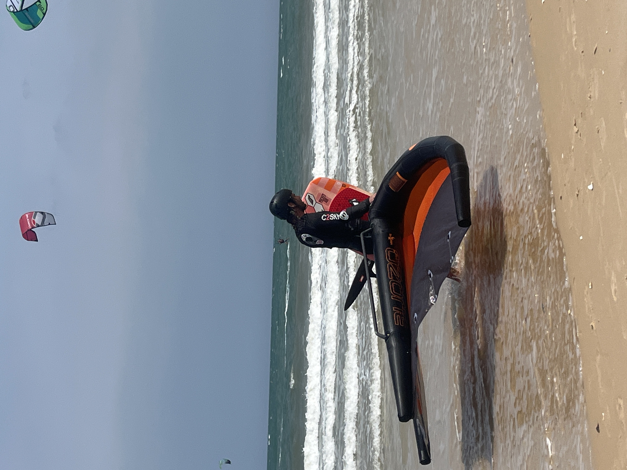 Kitesurfing and wing foiling session on a Vietnamese beach