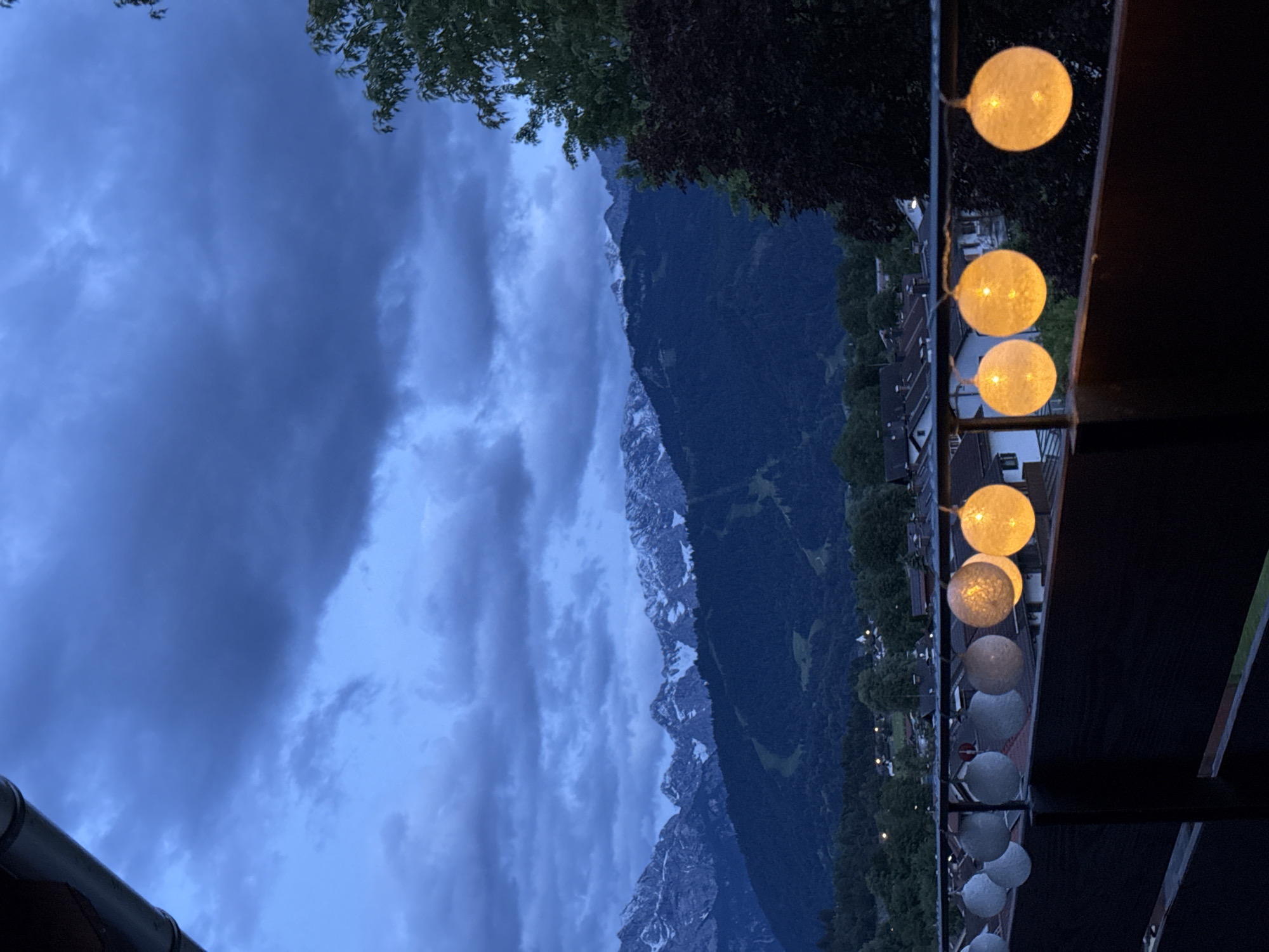 Evening balcony documentation session in Garmisch-Partenkirchen with illuminated lanterns
