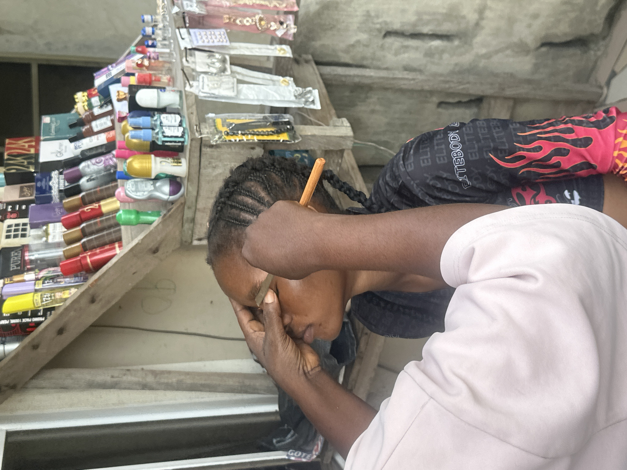 Informal street makeup session in Badagry, Nigeria