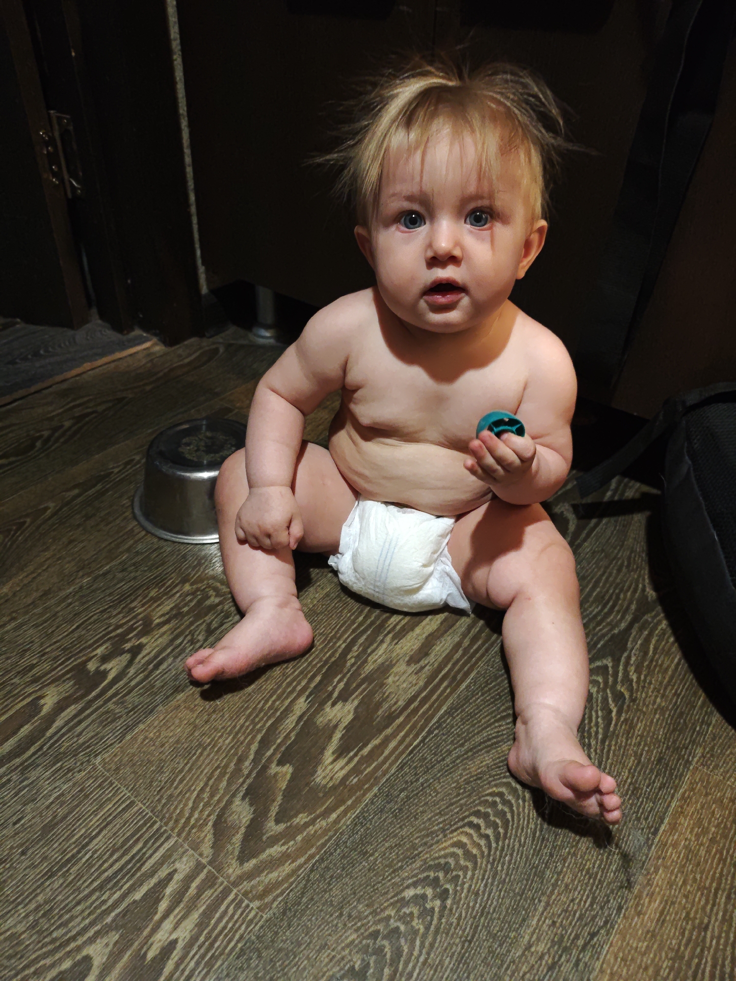Baby playtime on a wooden floor, Voronezh home
