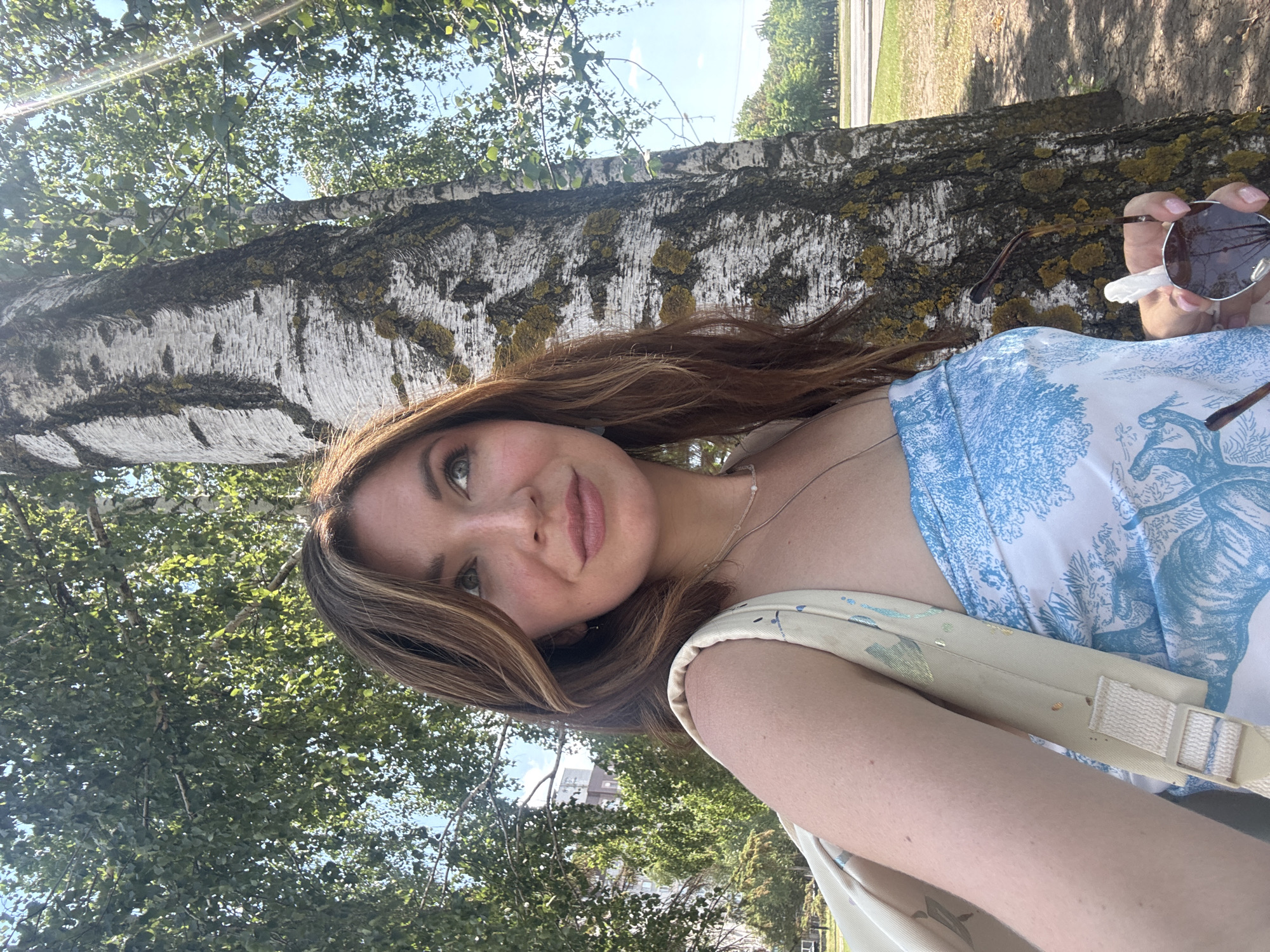 A summer morning in Kryvyi Rih: trees, selfies, and café signs