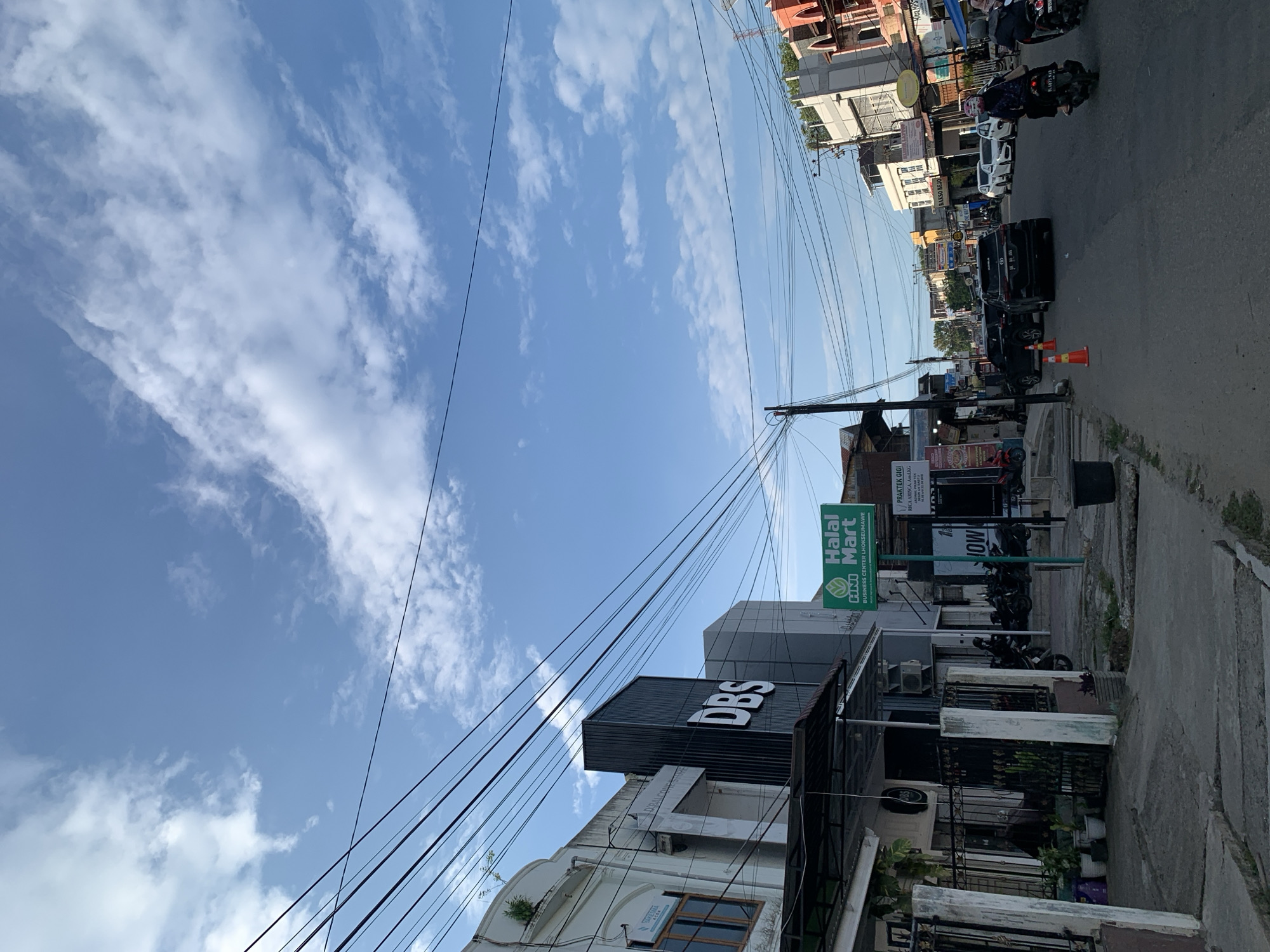 Daily life documented across Lhokseumawe, Indonesia streets and cafes