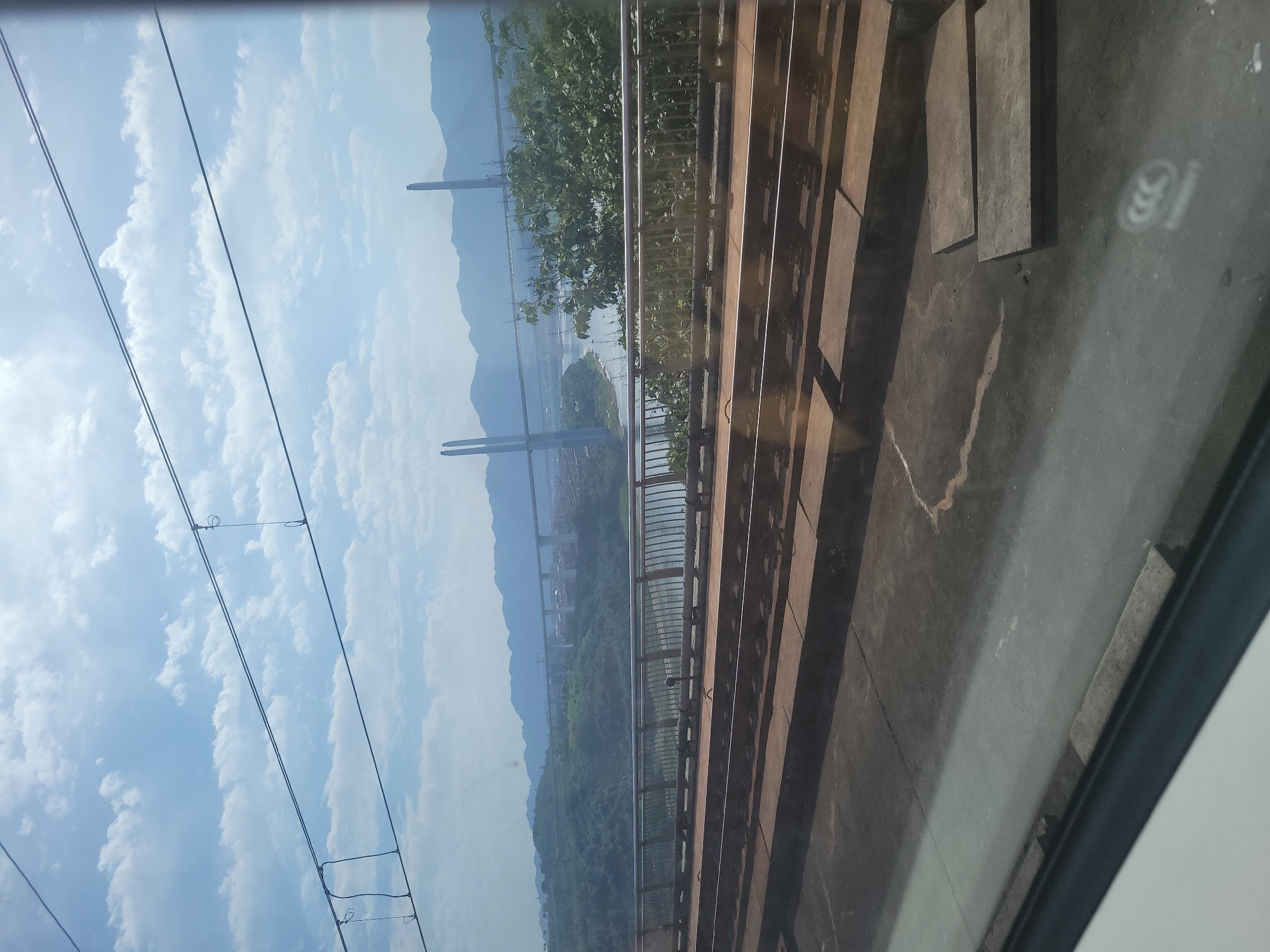 Train passenger captures bridge landscape views in Liangjiang, China