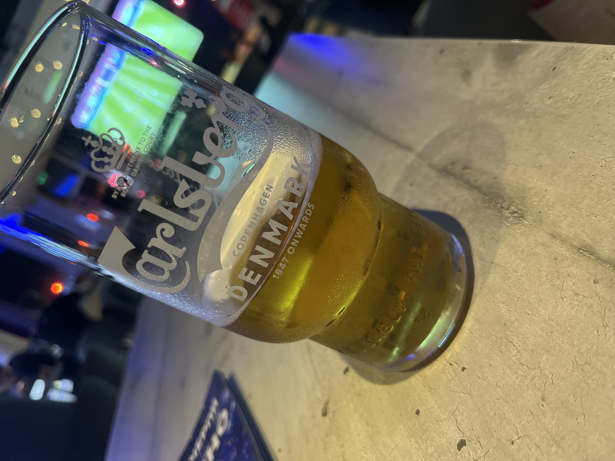 Soccer match viewing session at sports bar with drinks