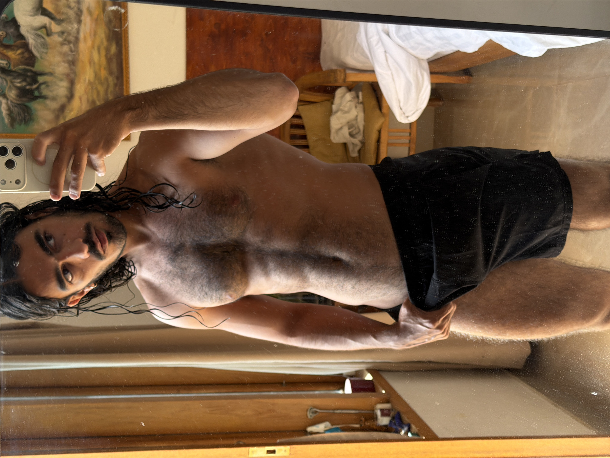 Man takes mirror selfies in North Kuta bedroom