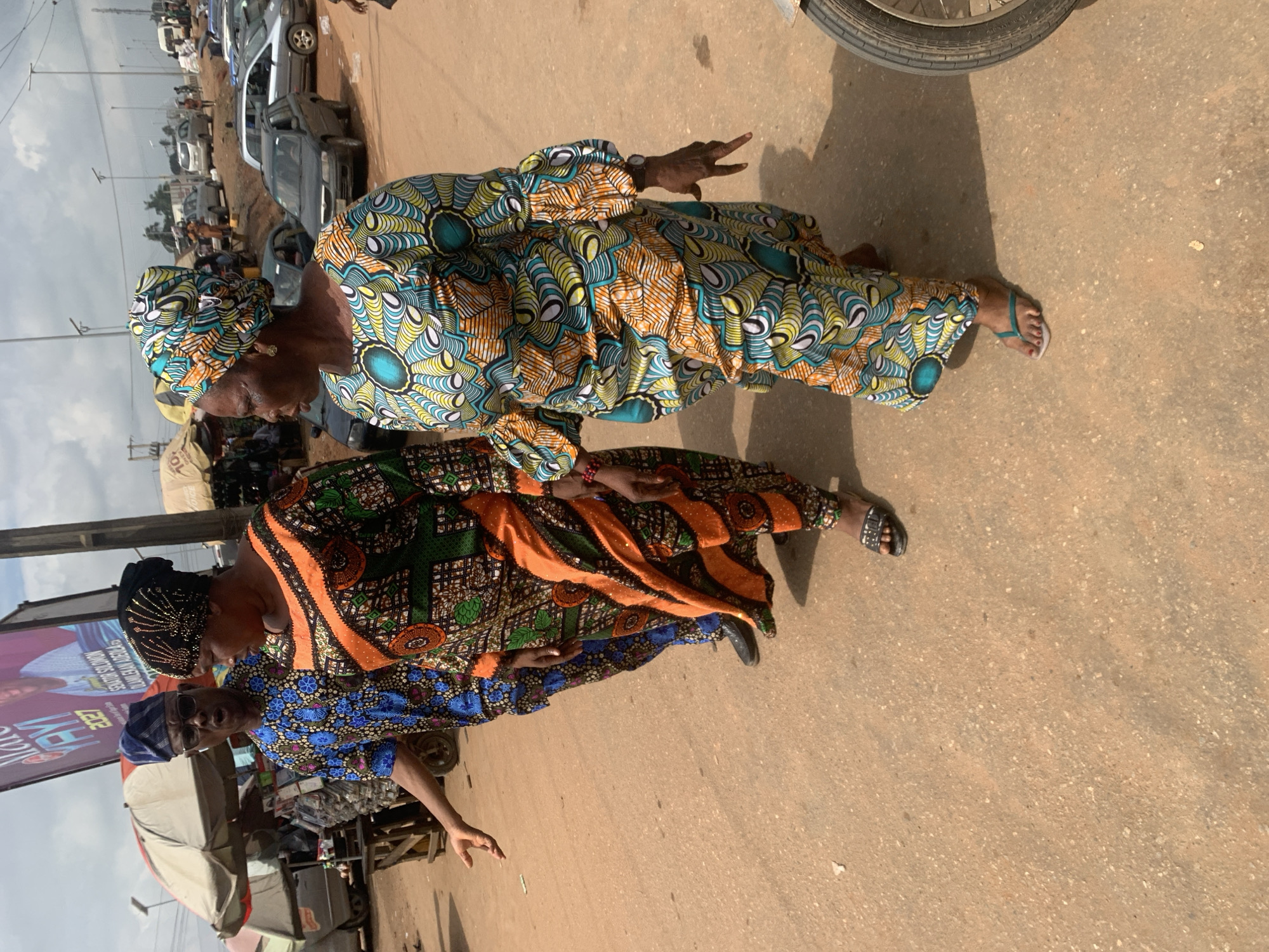 Street traffic and market activity on a busy Shagamu road