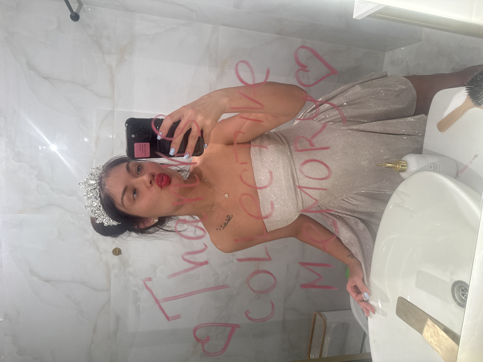 Woman takes mirror selfie in Moscow bathroom
